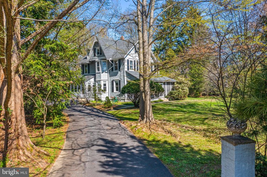 Welcome to Sylvan Side! Charles & Margaret Inman built this understated folk Victorian farmhouse in 1895. A full width screened porch is the perfect spot to enjoy an evening cocktail or morning cup of tea. The double front doors open to a symmetrical floor plan. A wide entry hall offers access to the living room, dining room, kitchen, powder room & 1st floor primary suite. Extra tall windows in the dining & living rooms provide abundant sunlight in the morning & afternoon, while the south-facing porch offers shade during the middle of the day. The living room has a bay window facing the western yard & driveway, a cased opening into the remodeled kitchen & a pair of pocket doors. The kitchen was upgraded in 2016 with custom cabinetry, granite counters and S/S appliances.  A painted hoosier chest pays homage to the vintage of the property. A bump-out off the kitchen provides the perfect spot for casual seating, since we all know that everyone gathers in the kitchen! There is ample room for a breakfast table as well. The mudroom and the laundry is conveniently located next to the kitchen. Out the rear door, there is another covered porch that has great views overlooking the stately trees, hydrangeas, rhododendrons and other specimen plants. Speaking of specimen plantings, wander around the grounds, and one will find many unique varieties of perennials, shrubs & trees. The current owners added a self-contained primary suite on the ground floor in 2007. One accesses it internally from just behind the staircase into a large & modern suite with a private bath that has a tiled shower, single sink vanity & toilet with a window overlooking the side yard. The bedroom itself is quite large, has a full wall closet and direct access to the rear patio that occupies the space between the kitchen & mudroom. The sellers also wanted to ensure that the exterior of this addition perfectly matched the original stucco of the 1895 house, & used an “old-school” craftsman to ensure the stucco mixture and finishing was nearly a perfect match. The original wood floors show all the patina of a life well lived over 131 years, yet remain in exceptional condition. On the second floor, there are four more bedrooms (one with another bay window) and a hall bath that was updated in 2006. A small sitting room over the entry hall provides supplemental closet storage & sufficient space to add a small desk should one want a little home office. In one of the bedrooms, you will find a full staircase to access the third floor.  While this attic is currently unfinished, the ceiling height is significantly high enough and there are eight windows to provide great light into this attic space. The basement is unfinished, yet provides ample additional space for storage. The house has been wired to provide for temporary power via a portable generator. Now it’s time to wander around the 1.5 acre property. The private patio is the perfect space to entertain all your family & friends. The perennial beds that surround the patio are just starting to flourish with hellebores, snowdrops, daffodils and other early blooming plants. Don’t worry, there are ample blossoms to come that provide nearly four seasons of color, including the mature tree peonies filled with buds. Tucked towards the rear of the yard is a wonderful little cottage in the woods (heated) that the current owners installed in 2007! With a delightful front porch, this one room cottage is a perfect space for an artist’s retreat, a meditation space or turn it into a delightful little library get-a-way. The original barn from 1895 is now a spacious 3-car garage. Via an exterior staircase, the 2nd floor of the barn was converted to a yoga space in 2008. This entire floor is fully insulated and heated, and a window A/C unit easily keeps this space cool in the summer months. So not only does one have the cottage for fun, the 2nd floor of the barn offers further options for one’s creative pursuits.