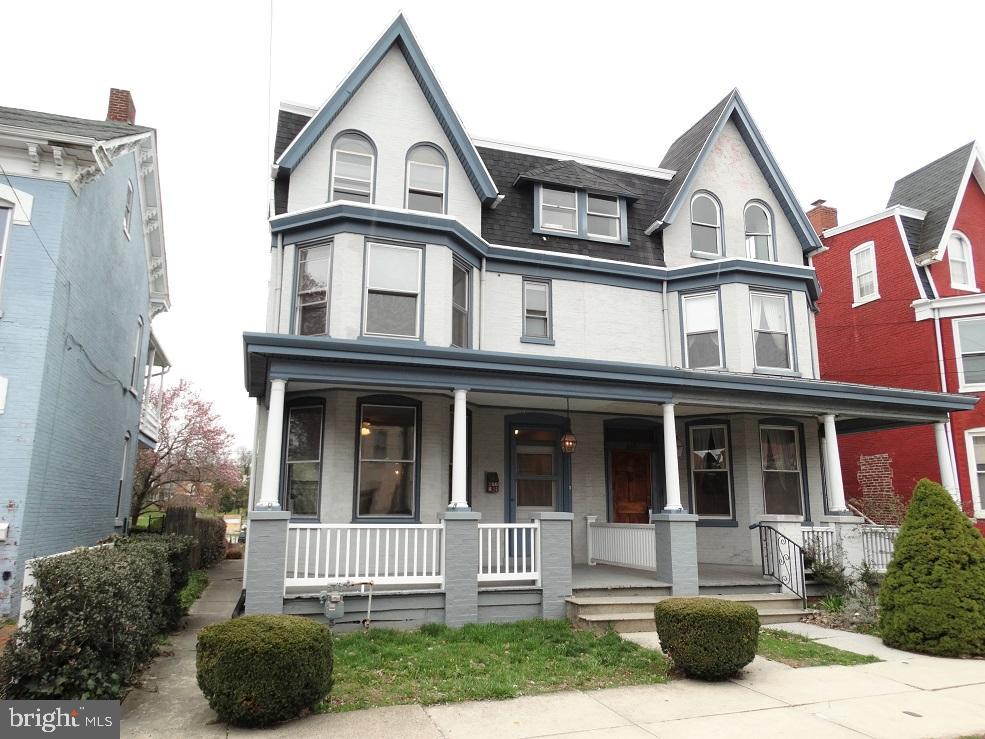 Modern details combine w/original charm. New flooring, fresh paint, classic woodwork & hardware, crown molding & swinging French doors. Beautifully crafted faux fireplace & updated kitchen w/new countertops, 2 Lazy Susans, pantry, & built-in desk area. Deep backyard w/potential for off-street parking in rear.