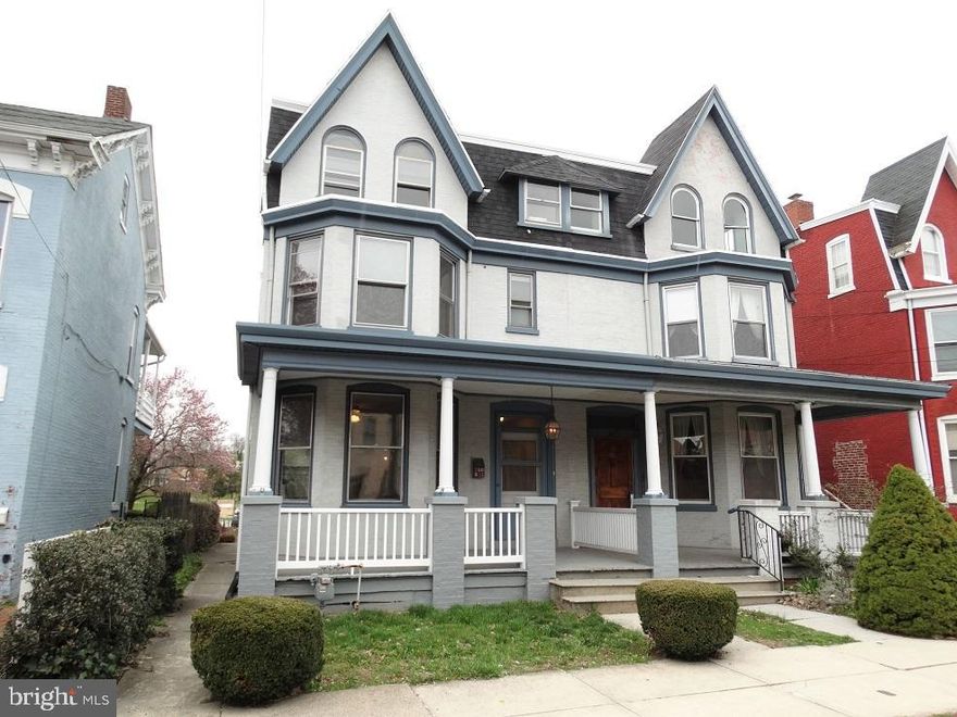 Modern details combine w/original charm. New flooring, fresh paint, classic woodwork & hardware, crown molding & swinging French doors. Beautifully crafted faux fireplace & updated kitchen w/new countertops, 2 Lazy Susans, pantry, & built-in desk area. Deep backyard w/potential for off-street parking in rear.
