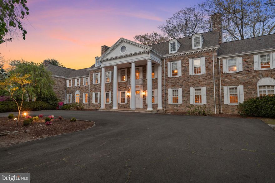 A Landmark Estate Defined by Legacy and Lifestyle

1035 Wright Drive is far more than a residence—it is a private estate designed for both retreat and recreation.

Originally constructed for John Elkins and later owned by Harold Katz, the estate carries a meaningful history tied to Philadelphia’s business and civic life. Over time, it has hosted U.S. Presidents, notable public figures, and professional athletes. The home has been exceptionally maintained and thoughtfully updated, preserving its character while integrating the level of comfort and functionality expected today.

Set on nearly seven private acres in Huntingdon Valley, the property offers a level of privacy that is increasingly difficult to find this close to the city. The grounds create the feeling of a protected country estate, yet you remain just minutes from Philadelphia and major commuter routes.

The main residence spans approximately 8,750 square feet and is defined by its proportions, craftsmanship, and flow. A central foyer with a sweeping staircase introduces a series of well-scaled rooms designed for both formal entertaining and everyday living. There are eight fireplaces throughout the home, along with detailed millwork, high ceilings, and expansive windows that bring in consistent natural light.

Formal spaces include a living room with French doors and custom built-ins, and a dining room designed for larger gatherings. More relaxed areas include a lounge with a wet bar and a sunroom wrapped in arched doors that open directly to the grounds.

The kitchen is designed to support both daily use and large-scale entertaining, with custom cabinetry, a substantial center island, and high-end appliances including Wolf and Sub-Zero. A separate chef’s kitchen with Viking appliances provides additional capacity, while a breakfast solarium offers a more casual, light-filled setting.

Upstairs, the primary suite functions as a private retreat, with a sitting room, dual fireplaces, and two full baths. Four additional ensuite bedrooms provide flexibility for family and guests, along with an office and media room. The upper level adds another bedroom, full bath, and a large open space suited for a game room or additional living area. An elevator connects all levels, enhancing both comfort and accessibility.

What sets the property apart is how the lifestyle extends beyond the main residence.

A nearly 20,000-square-foot sports and recreation pavilion sits separately on the grounds, creating a second, fully realized environment. It includes a full basketball court, indoor tennis and squash courts, a large indoor pool, gym, sauna, steam room, and multiple areas for gathering. It supports everything from daily routines to large-scale entertaining—without ever leaving the property.

Outdoor spaces complement that experience, with a resort-style pool, cabana, and multiple areas for entertaining or private retreat.

Located within the highly regarded Lower Moreland Township School District, the property combines privacy, accessibility, and long-term value.

Few estates combine this level of acreage, architectural heritage, elite recreation, and premier location. In a market where many luxury homes offer size but little soul, 1035 Wright Drive offers something far rarer: character, history, land, and lifestyle on a grand scale.

This is not simply a home—it is a landmark estate, ready for its next chapter.