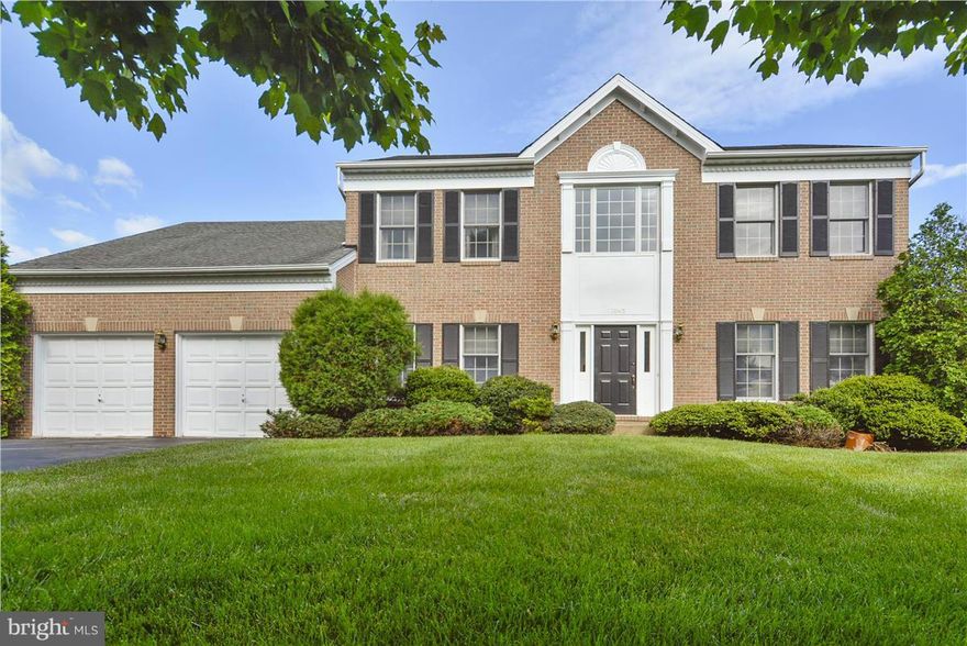 Beautiful and well maintained: large kitchen w/wood floors, lots of counter space open to family room, 2-story foyer w/wood floors.  Main level w/office/library, light and bright with windows &skylights.SpeciousFamily Room w/cathedral ceilings &fireplace.Large master bath with double vanity sinks and skylight.Stone back patio. Walk up bas ement. Fabulous location.