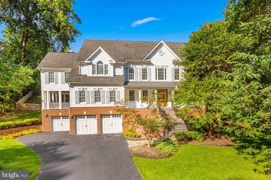 Set on a private and beautifully landscaped lot in the prestigious Franklin Park community, ​this home welcomes with timeless curb appeal, highlighted by freshly painted siding, double 8-foot front doors, and a wide stone front porch framed by mature trees. Inside, a sun-filled foyer with soaring ceilings and gleaming hardwood floors opens to gracious formal rooms with classic millwork and a warm, inviting family room anchored by a stone fireplace. The chef’s kitchen has been refreshed with new quartz countertops and a matching backsplash, and it flows seamlessly to the breakfast room and a screened porch that feels like an outdoor living room, complete with ceiling fan and TV for year-round entertaining.

The recently renovated owner’s suite is a true retreat, featuring a vaulted ceiling, expansive windows, and a spectacular spa bath with heated porcelain tile floors, an oversized glass shower, freestanding soaking tub, dual vanities, and designer fixtures. A custom walk-in closet crafted from maple with elegant built-ins and countertops completes the suite. Secondary bedrooms are generous in size and all upper-level baths have been updated with new vanities and fixtures. On the main level, a full bath was completely reimagined with new tile, shower, and cabinetry, while the lower level offers a spacious recreation room with new LVT flooring, a guest suite, full bath, and a wine cellar.

Outdoor living is equally impressive. A new stone fireplace anchors the private backyard patio, ideal for hosting gatherings or enjoying cozy fall evenings by the fire. The manicured lawn and brick garden walls create a serene backdrop, while a covered side porch extends the home’s entertaining possibilities. With a three-car garage, updated mechanical systems including a new HVAC unit, and thoughtful details such as new Emtek hardware, LED mirrors, and a finished garage floor, the property has been meticulously maintained and upgraded.

Franklin Park is one of McLean’s most coveted neighborhoods, known for its rolling hills, winding streets, and natural beauty, while offering unmatched convenience. The home is minutes from downtown McLean, Arlington, Tysons, and Washington, DC, and is served by top-ranked Chesterbrook Elementary, Longfellow Middle, and McLean High School. Outdoor enthusiasts will appreciate proximity to Pimmit Run Trail, Scott’s Run Nature Preserve, and the Potomac River, while both Dulles and Reagan National airports are within easy reach.

This extraordinary property is a rare opportunity to own a move-in-ready, fully renovated home in an established McLean community, blending timeless architecture with modern comfort and an ideal location.