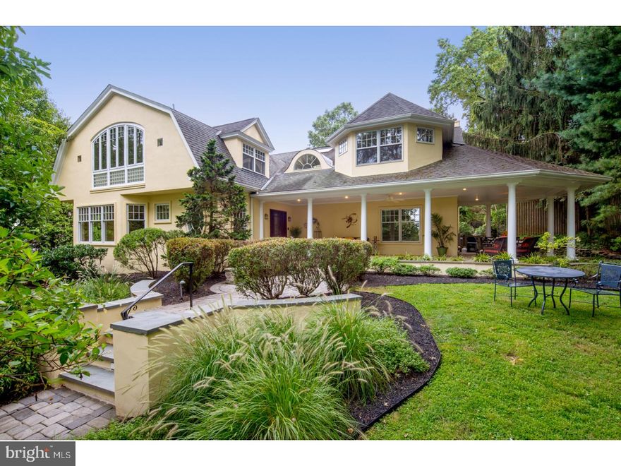 Surround yourself in serenity on over an acre of lush landscaped grounds graced by lovely gardens, charming walkways, beautiful perennials, tall trees & exterior lighting! On your fabulous tiled, wraparound columned front porch you can sip your coffee, read your morning paper and gaze at gorgeous greenery in peace, as ceiling fans offer a lovely breeze.   This magnificent like-new 6,500  sq ft Dutch Colonial home in desirable Gladwyne is a modern gem with tons of character and stunning details. The bright and sunny ambience thanks to large windows and skylights invigorates you every day. Wonderful 9', cathedral and vaulted ceilings maximize the awing feeling of airiness. Impeccably-designed, seamlessly-flowing entertaining rooms are ideal for your large or small gatherings. Five bedrooms, 4 full baths and 2 half baths provide optimal comfort for family and guests.   A soaring open entry foyer with gleaming hardwood floors and stairs to a sky-lit upper landing spills into the elegant living room and beyond. Enjoy meals in the fireside dining room enveloped by oversized windows with picture-perfect property views. The sprawling gourmet kitchen is a chef's dream with tremendous cabinet & granite countertop space, a huge center island with storage (prime real estate in any family's book!) and top-of-the-line appliances to inspire culinary creations. Grab a bite and feel the rays in the light-bathed breakfast area with a fireplace. The massive vaulted family room with exposed beams and a fireplace is where everyone comes to relax, with 3 sets of glass-paneled French doors leading outside for indoor-outdoor parties. Another fireplace awaits in the private wood-clad library with built-ins and outdoor access. A home office has its own doors to the wraparound porch as well.  The generous upstairs master bedroom retreat has a fireplace and double sets of doors to a phenomenal sunroom overlooking nature's beauty. Massive fitted closets with built-in storage and a glorious master bath complete the allure. Other highlights include a lower level game room, playroom, security system, two 2-car garages, lawn irrigation, and a large private rear yard for the family and pets!