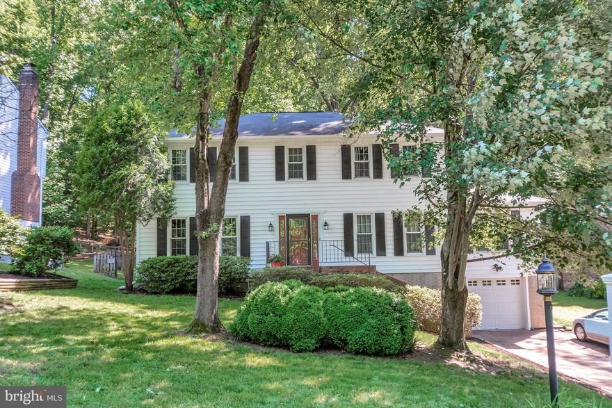 PRICE IMPROVED! This fabulous home has so much to offer! From the curved staircase when you enter to the incredible level and private backyard, this Virginia Colonial with tons of curb appeal will steal your heart. NEW: FAMILY ROOM JUST REPAINTED TO A GREY WHITE. IT'S BEAUTIFUL! MUST SEE! **MAIN LEVEL: Upgraded Hardwood Floors flow throughout the 2 story foyer, Office, and Family Rooms. Brand New Carpet is featured in the formal Living and Dining Rooms. The freshly painted Kitchen has brand new granite, white cabinets, double oven, gas cook top, and a brick hearth.  Right off the Kitchen is a custom walk in pantry and a Laundry Room with front loading washer and dryer that convey with the sale. The Kitchen opens into a large Family Room with a cozy gas fireplace. Both the Kitchen and Family rooms overlook the lovely backyard.**UPPER LEVEL: The curved staircase leads to the Upper Level, also featuring brand new carpeting. A large landing makes this area feel bright and open. The spacious Master Bedroom boasts 2 walk in closets and an En Suite Bath. Wait until you see this Bathroom! Brand New Tile enhances this space complete with dual sinks, a wonderful jetted soaking tub, and large shower. Two other nicely sized Bedrooms plus another full Bath are on the Upper Level. **LOWER LEVEL: The Lower Level could serve as a separate apartment or au pair suite. This level has an entrance through the garage into a Flex Space that is currently used as a game room. A Rec Room plus Kitchenette complete with mini refrig, wet sink, and microwave (under the cabinets) offer more finished square footage. The legal 4th Bedroom with egress window, closet, and built-ins in addition to a large 3rd Bathroom are perfect for guests. **EXTERIOR: A Spacious Deck overlooks the serene yard. Plenty of room for games and fun here! This prime fenced lot backs to woods for privacy. **COMMUNITY: Aquia Harbour is known for its many amenities: 2 pools, stables, golf course, tennis, Country Club, pre-school and more. **LOCATION: Located minutes from I95 and less than 10 miles to Quantico and the FBI, Aquia Harbour is arguable North Stafford's best commuter neighborhood. Book a tour today--you don't want to miss this incredible home!