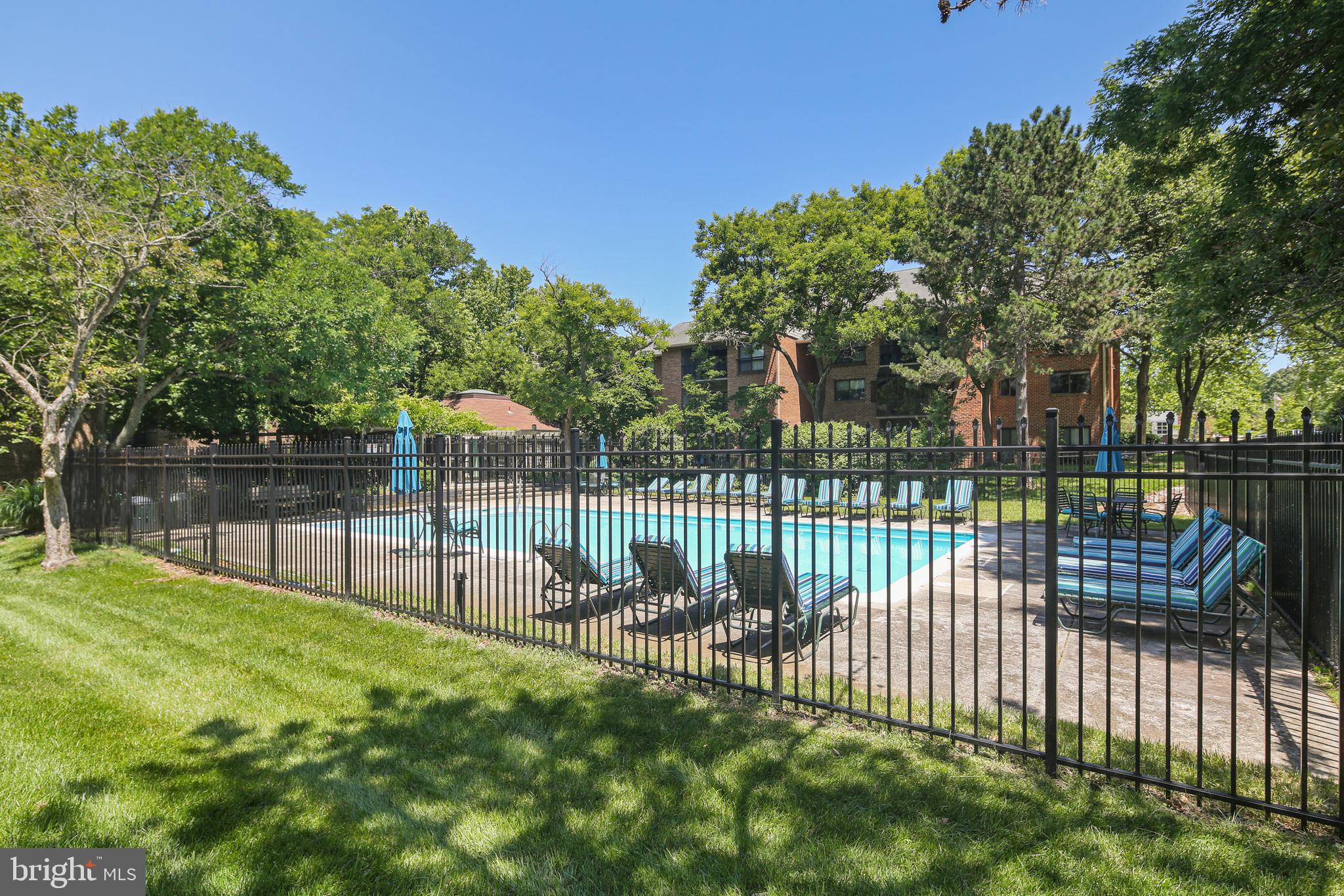 Reduced to sell, move in today! This beautiful garden-style 2-bedroom, 2-bathroom condo is located on the top floor of a charming 4-story building, offering privacy and serene treetop views. The open-concept layout is filled with natural light, featuring a spacious living area, modern kitchen, and private balcony perfect for morning coffee or evening relaxation. Both bedrooms are generously sized, with the primary suite offering an en-suite bathroom and walk-in closet. Enjoy the peaceful ambiance of garden-style living with the convenience of top-floor tranquility. The pool during the summer months and easy access to the Rec center directly across the street are great amenities to have.