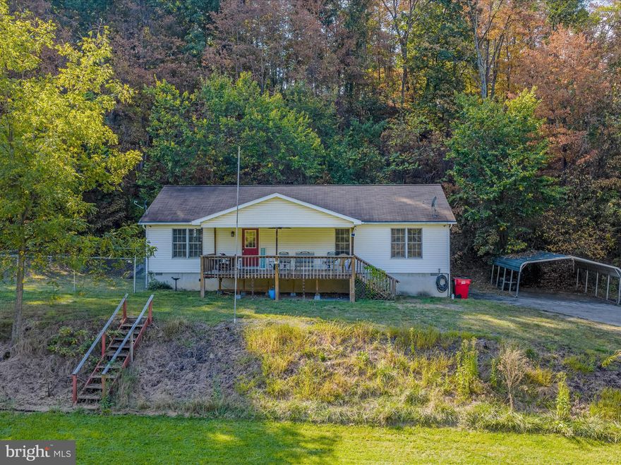 Very well maintained 3 bedroom 2 bath rancher just minutes from downtown Berkeley Springs and easy access to the bypass. The property is on over 2 unrestricted ares! Fenced in side yard, small back and side decks. Enjoy the wonderful covered Porch on the front of the home as well. This property also includes a paved driveway and a detached car port. Professional pictures will be up soon!