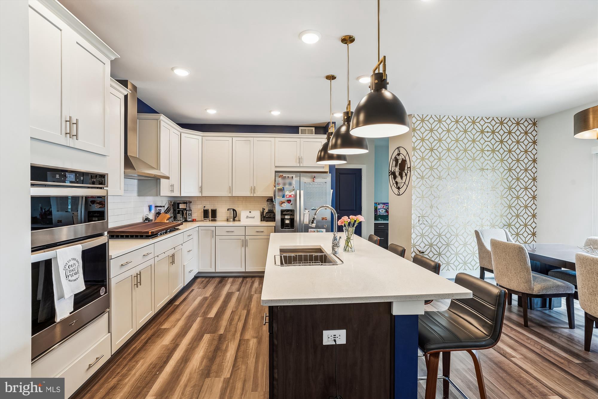 One-of-a-Kind Custom Smart Home in Potomac Shores!
Welcome to this truly exceptional, fully custom home—professionally designed by an interior designer with every detail thoughtfully curated for style, function, and comfort. Located in the highly sought-after Potomac Shores community, this home offers the perfect blend of luxury living and cutting-edge smart technology.
From the moment you enter, you'll notice the difference—gorgeous hardwood floors span the main level, complemented by a cohesive and professionally styled color palette, designer lighting, and high-end finishes throughout. The gourmet kitchen is a showstopper, featuring stainless steel appliances, elegant custom cabinetry, designer hardware, and expansive countertops that make it perfect for cooking and entertaining. The eat-in kitchen flows effortlessly into a spacious, light-filled family room designed for everyday living and relaxation. A dedicated office space adds convenience for remote work, while a stylish powder room completes the main level.
Step outside to the upgraded Trex deck with low-maintenance vinyl railings—an ideal spot for entertaining or enjoying a quiet moment outdoors.
Upstairs, the grand primary suite offers a tranquil retreat with a spacious walk-in closet and a spa-like five-piece en-suite bathroom, complete with designer-selected fixtures and finishes. Three additional bedrooms on this level provide ample space for family or guests.
The fully finished walkout basement offers a large recreation area, a full bathroom and bedroom, and seamless access to the backyard.
This is also a fully integrated smart home, giving you control of locks, garage doors, sprinkler system, lights, appliances, and thermostat—all from a convenient app on your smartphone.
A spacious two-car garage and mud room completes this meticulously designed, move-in-ready home.
Situated in a prime location, this property is just minutes from I-95, Quantico, and an array of shopping and dining options. The community amenities are second to none. Residents of Potomac Shores enjoy exclusive access to a 13,000-square-foot indoor/outdoor playground, a Social Barn for gatherings, a Fitness Barn with a modern gym, movement studio, and yoga lawn, as well as a family pool with a sundeck, cabanas, kids’ pool, and snack bar. Outdoor enthusiasts will appreciate the 5+ miles of trails for running, biking, or walking, as well as opportunities to launch a kayak, join social clubs, or play a round of golf at the Potomac Shores Golf Club – the only publicly accessible Jack Nicklaus Signature Design course in Northern Virginia. With convenient commuting options to Quantico, Ft. Belvoir, and the Pentagon, this home offers an unbeatable combination of luxury, convenience, and community. Don’t miss the rare opportunity to own a one-of-a-kind custom smart home in the vibrant Potomac Shores community!