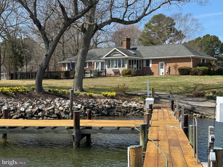 A lovely waterfront home located in Sailors Retreat. Three bedrooms and two and half baths. primary bedroom, sunroom, and family room have a beautiful view of Island Creek. Nice deck and patio for relaxing 
Two car garage with walk upstairs to the attic. The dock can accommodate two boats with a water depth of 3'-4' MLW.    Buyer must verify the water depth