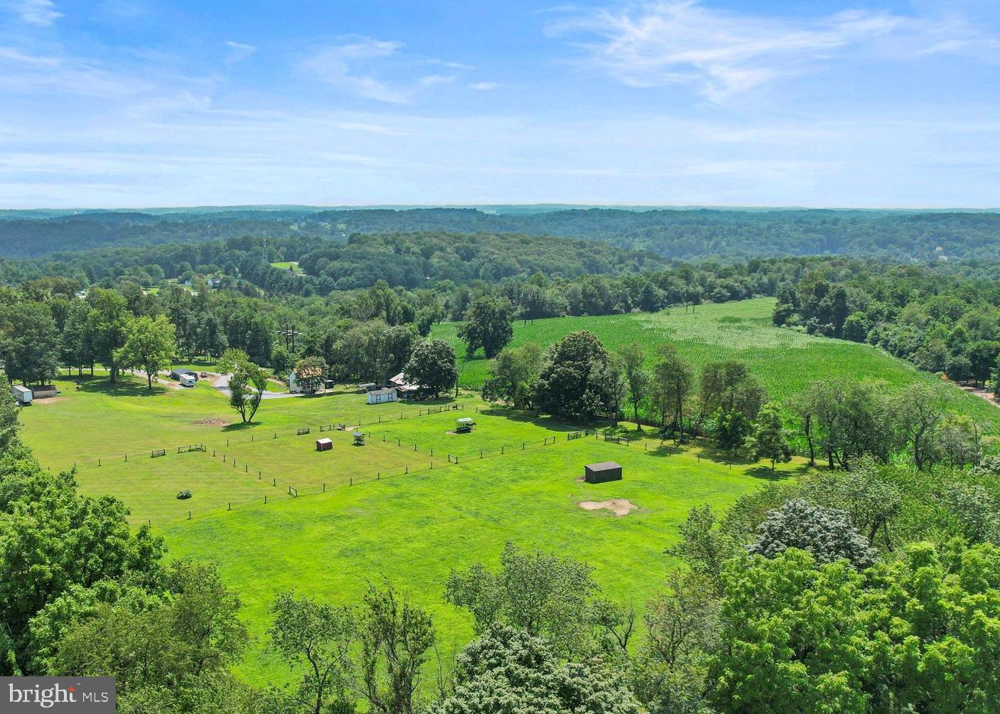 Welcome to 1725 Goose Town Rd, Coatesville—a breathtaking 58-acre horse lover’s paradise featuring open meadows, wooded riding trails, tillable acreage, a secluded pond, and spectacular sunset views. The 2-bedroom, 1.5-bath main house offers a rustic log-style interior with exposed logs, original wood accents, and concrete countertops, blending warmth and character with comfort. A full wraparound deck was previously removed, but the home is ready for a new one to be added if desired. Though a few minor final touches are still being completed, the home is move-in ready.
The property also includes a 3-bedroom, 1-bath single-wide trailer, updated two years ago with new windows, flooring, cabinets, and paint. Additional amenities include a heated and air-conditioned garage/shop building and an RV pad with septic and water hookups. Three separate electric meters serve the house, trailer, and RV pad/garage. Whether you're seeking privacy, natural beauty, or a functional equestrian setting, this property offers it all.
Please note: The listed taxes are not accurate, as this property consists of a total of 8 separate parcels being sold together as one. It is also enrolled in Act 319 (Clean and Green program), which provides significantly reduced property taxes.