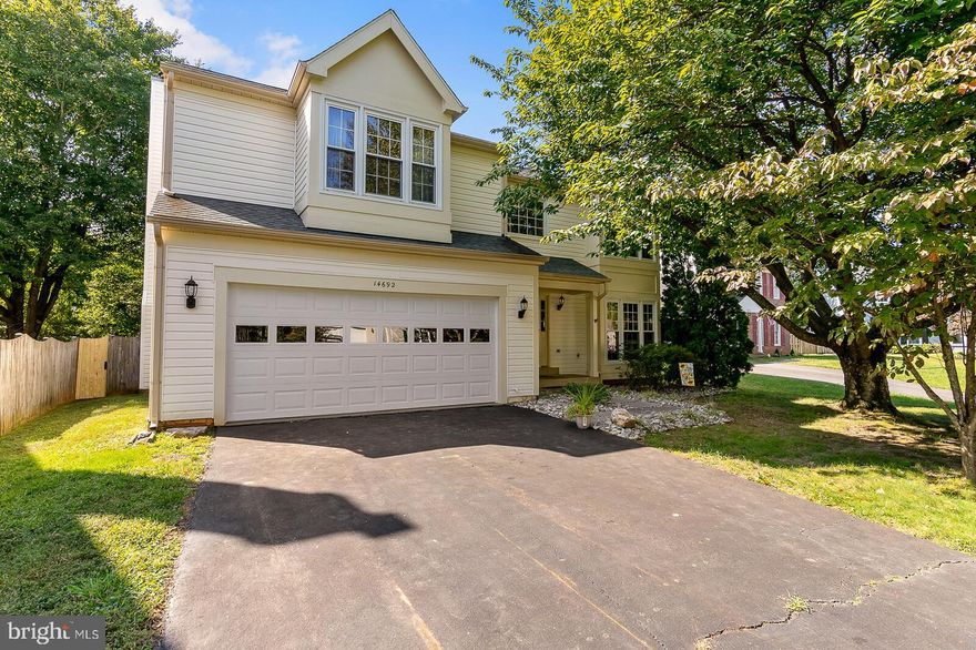 Prepare to be impressed when you walk in to this spacious home with over 2,500 sq.ft. of living space just on the top  two levels alone. The main level incorporates a welcoming living room and dining room, a huge kitchen w/a light and bright breakfast nook, stainless steel appliances and lots of counter space, a guest bathroom and a cozy family room with a fireplace to keep you warm on those cold winter nights. Upstairs, you'll find four dreamy bedrooms, full bathroom and a laundry area. The master bedroom suite has vaulted ceilings, a large walk-in closet and ensuite bath w/double sinks, garden tub and separate shower. Entertain in grand style in the spacious, private, flat and fully fenced backyard w/a large deck and mature trees. And, be prepared to use your imagination when entering the basement... with over 1,000 sq.ft. of unfinished space (including a rough-in for a full bathroom), you'll have the perfect opportunity to make it your own. Minutes to I-95, commuter lots, VA Railway Express, Potomac Mills Mall and Quantico Marine Base. Hurry, this one won't last.