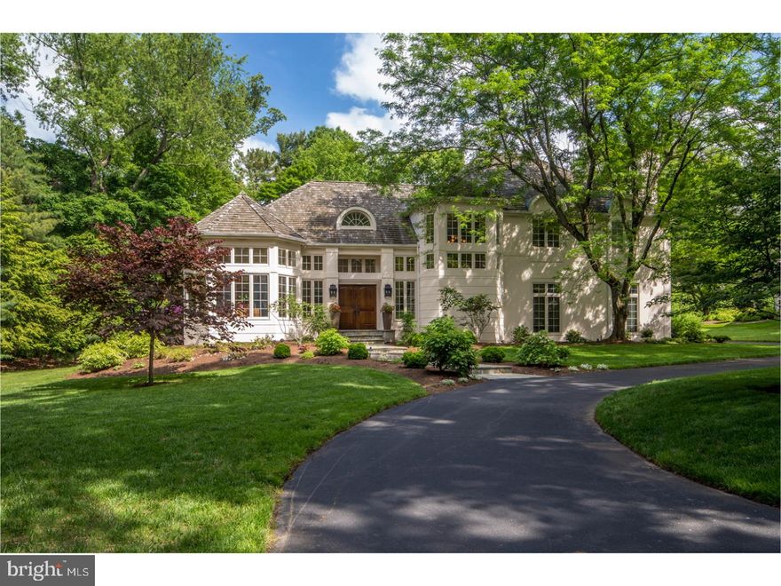 Perfect for the active family, this spectacular estate manor home is fully updated, set in a quiet, private location, and within walking distance of everything! What a rare combination of all you could want on the coveted Main Line! A circular drive, stucco exterior, cedar shake roof & pristine landscaping optimize curb appeal. Since the current owners purchased the property in 2014, they've done extensive updating & remodeling. A stunning new chef's kitchen by Paradise Custom Kitchen, luxurious master bath renovation, full high-quality finished basement, hardwood floors refinished & added throughout, new landscaping, and many other fine details make this house 100% ready to move into and enjoy. Experience a grand welcoming in the dramatic 2-story Reception Hall with columns & soaring ceilings. At left is a coat closet, hall bath & octagonal office with floor-to-ceiling built-ins, vaulted ceilings & windows on 5 exposures viewing greenery ? sure to be one of your favorite relaxing spots. Positioned along the back is the formal entertaining space: a living room with high vaulted ceilings & stone fireplace, and an elegant dining room adorned with crown molding & wainscoting. Both lead to the peaceful patio to extend gatherings outdoors. At right beyond the main stairs awaits the beautiful kitchen/family room area, the magnet of the home. The meticulous remodel of the kitchen, styled with natural quartz countertops, an oversized center island, white subway tile backsplash & top-grade appliances, includes an opening to the family room, making it easy to stay connected as a busy family. The breakfast room spills out to the rear patio where you can appreciate nature, and the family room offers custom built-ins & a marble-surround fireplace. Off the kitchen sits a convenient mudroom accessing the laundry room & 3-car garage that serves as an extension of space. A sunny hardwood landing greets you on the way to the 2nd floor with 4 generously-sized bedrooms & 3 full baths. The master suite boasts his & her closets and a large, lovely renovated private bath with double sinks & a soaking tub overlooking the rear property. A nicely finished carpeted lower level with a home gym, wet bar, TV and game areas, bedroom, full bath & unfinished area for a workshop or storage. Live in serenity yet near it all, only a few minutes walk from Suburban Square shops & restaurants, Downtown Ardmore, SEPTA and Amtrak station, Lower Merion HS & more!