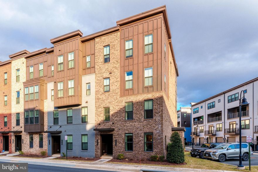 Welcome home to this FULLY FURNISHED 3 bedroom, 2.5 bath condo, a former model home by NV Homes. Urban-inspired living in the amazing Downtown One Loudoun - a premier destination and walkable community that integrates a town atmosphere with great neighborhoods and an exciting downtown of retail, dining, and entertainment.  Enjoy turn-key living in this 2 level townhouse style condo featuring 1,610 sq ft of living area. Light filled, end-unit with upgrades throughout.  Open concept layout on the main level with wood floors, a beautiful white kitchen, granite counter tops, subway tile backsplash, under cabinet lighting, stainless steel farm sink, counter seating, ample cabinet storage and pantry.   Retreat to your spacious primary suite with 2 walk-in closets, a primary bath with frameless shower, bench seating, 2 separate shower heads, dual sink vanity and a separate water closet.  This amazing floor plan will surprise you with its upper level walk-in laundry room and bonus storage/utility room, 1 car attached garage and driveway for 1 additional car.   Mere steps to a variety of restaurants, shops, Trader Joe's grocery, Barnes & Noble, central plaza area and The Barn at One Loudoun, a community amphitheater and barn venue that hosts community social events. Just a short stroll to the impressive Club at One Loudoun, the community recreation facility includes an outdoor pool, dog park, half-court basketball, meeting rooms, an outdoor multipurpose court, tennis courts and sand volleyball. Ideally located at the intersection of Route 7 and Loudoun County Parkway, offering exceptional accessibility across NVA, just 5 miles to the Ashburn Metro Station, 7.5 miles to Dulles Airport and 30 miles from WDC.