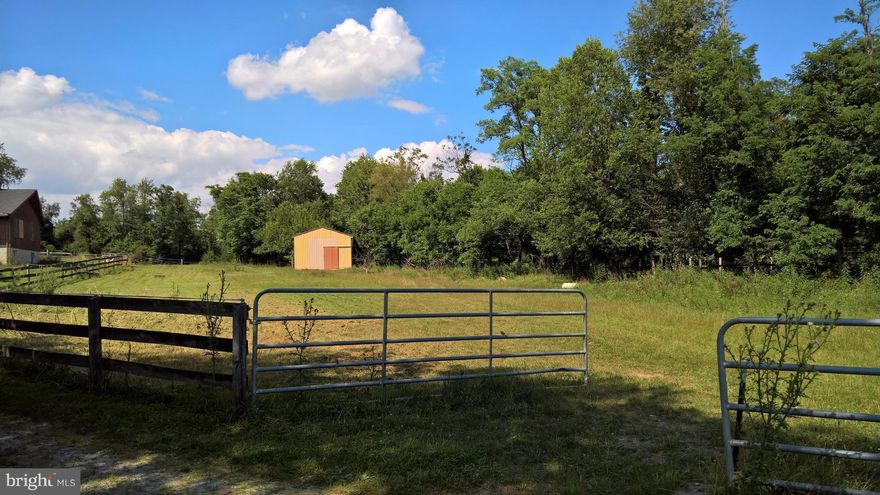 Foundation, well, and septic for three bedroom home on this 5 acre lot.  Foundation measures approximately 1,090 ft2.  Property features metal sided stable with concrete floor, riding ring, and run-in shed.  Property has limited restrictions.  Home was struck by lightning, is uninhabitable, and is in process of being demolished.  Do not enter premises without agent or owner.  Documents available.