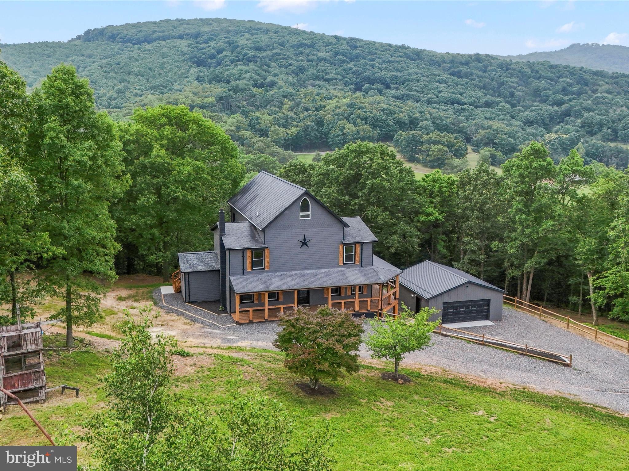 Escape to this stunning newly renovated estate in Romney, WV offering the perfect blend of modern comfort and peaceful country living. Situated on 7 private acres this spacious 7-bedroom, 6-bathroom home is ideal for large families, multi-generational living or even a vacation retreat.
Inside you'll find 4 floors and two full kitchens. One on the main floor featuring luxurious leather-finished granite countertops and hints of walnut live edge throughout the home. Another in the fully finished basement, both including all appliances. The second floor offers a mother-in-law suite for extended stays or multi-family living. This home offers two convenient laundry rooms-one located in primary bedroom for ultimate ease and privacy, and another on the third floor, providing easy access for additional bedrooms.
Entertainment and relaxation abound with a furnished movie theater, game room with a pool table, and a dedicated coffee station for your morning brews. There's also a versatile basement bonus room, perfect for a home gym, personal studio or workshop.
The property also boasts a two-car garage, ensuring plenty of space for vehicles or storage. Whether you're looking for a permanent residence or a getaway, this home is only two hours from the D.C. metropolitan area, Pittsburgh or Charleston. This home offers the perfect balance of luxury, convenience and tranquility in the mountains.
Don't miss this rare opportunity-schedule a tour today!