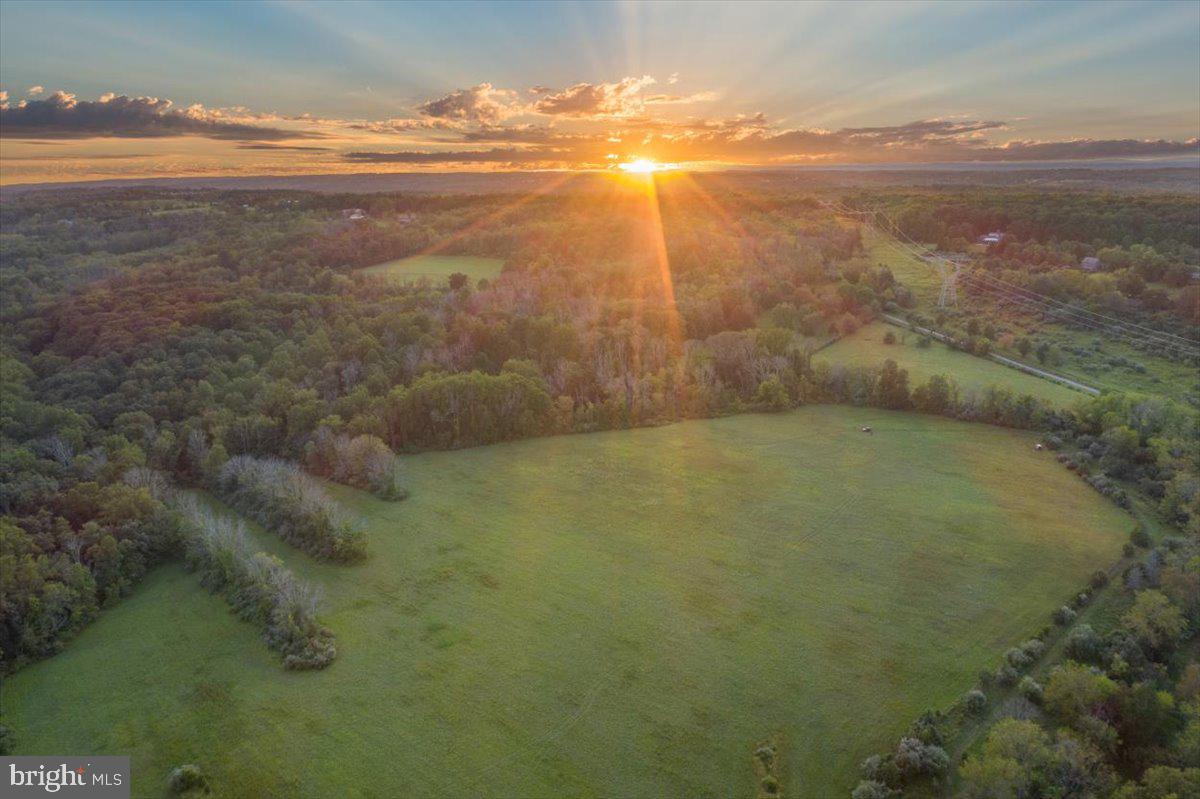 This 47+ acres of stunning countryside will inspire artists to set up their easels and create a masterpiece. The picturesque, rolling property is mostly open, consisting of a beautiful blend of fertile fields and lush meadows, bordered by woodlands, to allow panoramic views of sunrises and sunsets over the gently sloping countryside. This enticing property offers priceless serenity along with many opportunities to pursue various agricultural interests amidst the flora and fauna of Solebury Twp. Abundant wildlife for the outdoor enthusiast - an ideal setting for those inspired by beauty and nature. This impressive property is adaptable to a great many uses and poses endless possibilities including up to a 7000 sq ft home and also for equestrian pursuits, organic farming, a gentleman's farm, or country retreat. R1 Zoning, granted into Act 319 - an Agricultural Land Preservation Easement. Located in the award-winning New Hope-Solebury School District, just west of the Delaware River and quaint river villages, and is as convenient as country living gets! Drivable to New York and Philadelphia.