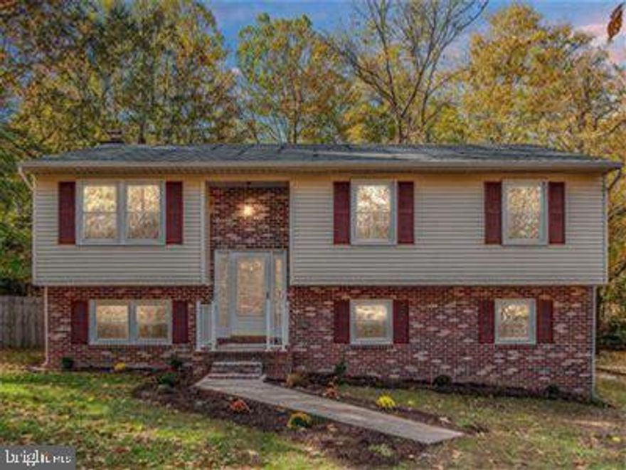Discover this South Stafford gem, just minutes from downtown and the Leeland Commuter Lot. Recently refreshed, this 4-bedroom, 3 full-bath home sits on a spacious corner lot with a newly paved driveway. The captivating interior boasts an open kitchen/living floor plan, featuring upgraded granite countertops and stainless-steel appliances. Enjoy updated laminate flooring throughout the main level. The owner's retreat includes a sizable walk-in closet and an ensuite bath with ceramic flooring and surround. A second full bath in the hallway is perfect for the kids. The basement offers a large family room with a small bar area, along with a generous lower-level bedroom and a full bath with ceramic flooring. The privately fenced backyard features a stunning stamped concrete patio. Plus, indulge in outdoor entertaining on the huge upper deck, making this home must-see in South Stafford.
