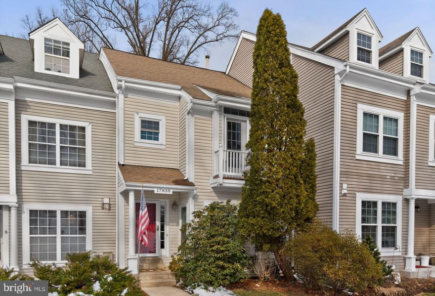 Welcome to this wonderful three-level townhome, perfectly situated on a premium lot that adjoins a peaceful, wooded common area. Located in the highly sought-after Lake Hallowell community, residents enjoy a resort-like lifestyle with tennis and pickleball courts, a community pool, three playgrounds, and walking paths including an approximately 1.5 mile loop around the lake. Step inside to an inviting, open-concept main level featuring a beautifully remodeled tablespace kitchen. This chef’s space boasts durable Dekton countertops, beautiful semi-custom cabinets, tile backsplash, gas cooking, a new built-in microwave, approximately 1-year-old refrigerator, approximately 3-year-old dishwasher, and abundant storage across multiple pantry closets. From the kitchen, step out onto the wood deck to enjoy serene, wooded views. The main level continues with a step-down living room and a formal dining room, both featuring elegant wood floors, crown and chair rail moldings, and designer lighting. A convenient powder room with a linen closet completes this level. The upper level serves as a private retreat, highlighted by a primary suite with soaring ceilings, lots of natural light, ceiling fan, and a large walk-in closet with custom shelving. The gorgeous, 2020-remodeled primary bathroom features a tiled shower, a soaking tub, a double-sink vanity, and a private water closet with a stylish barn door. Two additional bedrooms both with ceiling fans and a full hall bathroom provide plenty of space for family or guests. The finished walk-out lower level offers a cozy family room centered around a wood-burning fireplace, with upgraded sliding glass doors leading to the backyard. This level also includes a versatile finished den or office, a full bathroom with upgraded tile flooring, and a laundry room equipped with front-loading appliances and a utility sink. Additional high-value improvements include a new HVAC system with an air purification system (2021), a roof replaced with 30-year shingles (2006), and replaced windows, lower level sliding glass door, and siding—all backed by lifetime warranties. Plus, two prime assigned parking spaces directly in front of the unit. Minutes from downtown Olney’s shopping and dining, MedStar Montgomery Medical Center, public and private schools, and a short drive to the ICC highway. You are going to love making this your home!