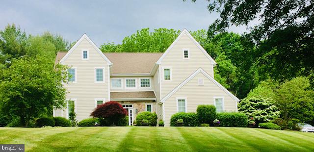 Hillside location on this beautifully unique colonial located in esteemed Falcons Lair. This home is sited “above it all” with tranquil views of a neighboring pond, treetops, sunrises and nature. Both the front lawn and back yard enjoy the character that is hard to find in typical subdivisions: gentle hills, beautiful views in every season. The peaceful back yard is wide and open for play and gatherings. Be sure to view the photos and virtual tour. A fresh, custom-color HardiePlank exterior pairs with many newer windows and slider doors. Inside, a two-story foyer with glowing wood stairs and transom-topped openings makes a welcoming first impression. The sunlit foyer opens to formal living and dining room and a quiet flex room/office. Upstairs, the spacious private suite offers a gas fireplace, walk-in closet and en-suite bath with double vanity, separate tub and shower. Three spacious additional bedrooms and a hall bath complete this level.
The “heart of the home” kitchen includes a double/convection range, wine refrigerator, Bosch dishwasher, stainless French-door refrigerator, neutral quartz countertops, and a sunny eating area. It opens to an expansive great room anchored by a floor-to-ceiling natural stone fireplace overlooking the deck and backyard.
The basement has attractively painted floors and walls and is currently used for storage and flex space. Coveted neighborhood of well-kept homes on wide lots, just minutes to Kennett Square Borough, Longwood Gardens, Route 1/52/202, shops, dining, and parks. Public record shows strong resale in this enclave—come see why Falcon’s Lair remains a perennial favorite.