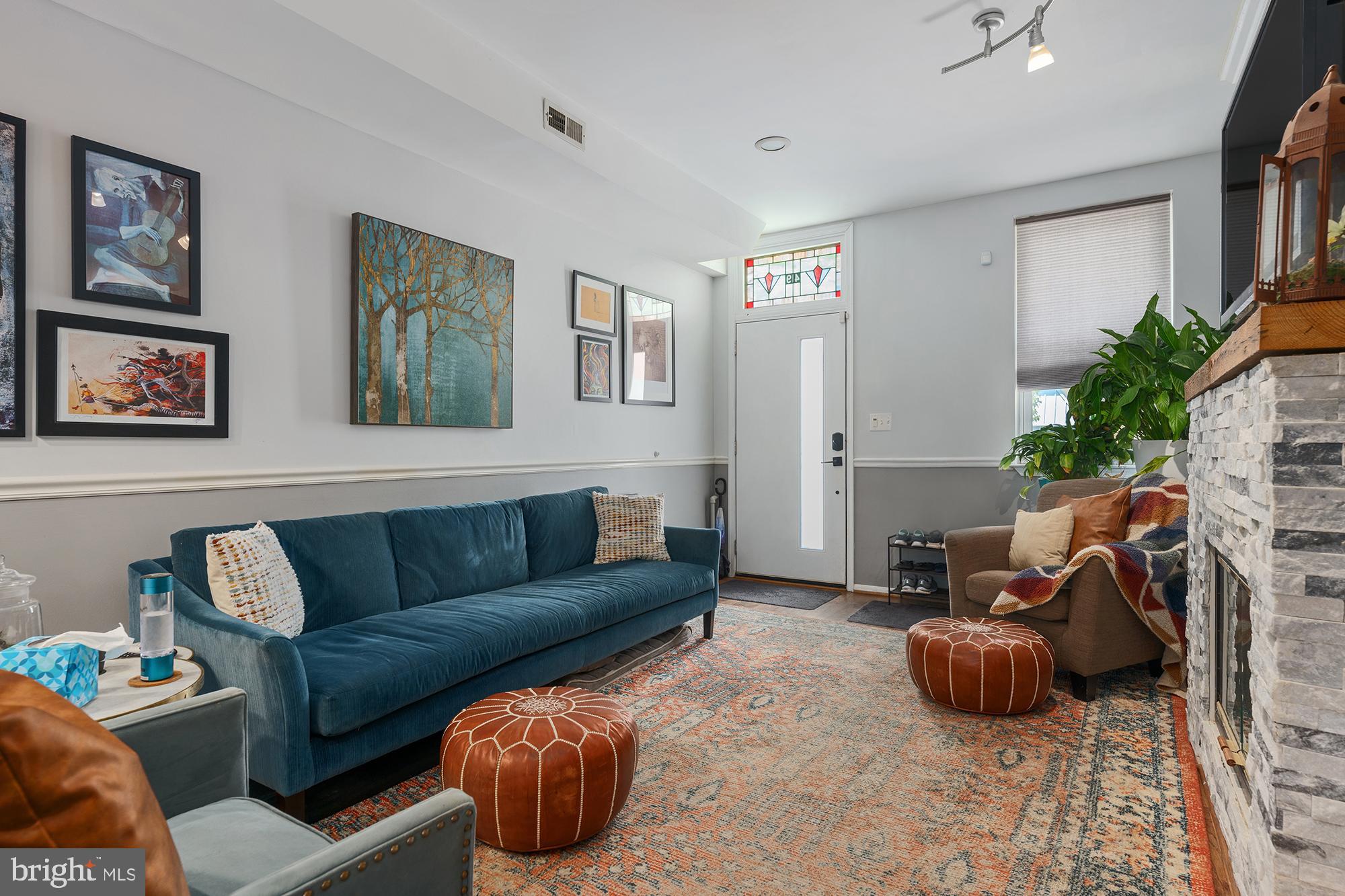 Welcome to 419 S Ann Street — a thoughtfully renovated and impeccably maintained residence located in the heart of historic Fells Point. Ideally situated just steps from the waterfront, award-winning dining, and the green spaces of Patterson Park, this property offers the perfect blend of refined urban living and comfort.
The main level features solid hardwood flooring throughout, sophisticated curved walls, and a striking custom stone fireplace with built-in shelving. The spacious dining area flows into a fully updated gourmet kitchen, equipped with quartz countertops featuring a waterfall edge, full-height custom tile backsplash, stainless steel KitchenAid appliances, an eat-in bar, and custom cabinetry designed for both beauty and function. Direct access to a private rear patio creates a tranquil outdoor retreat, complete with custom stonework, horizontal privacy fencing, and a mature fruiting fig tree—ideal for entertaining or quiet relaxation.
The second floor comprises two generously proportioned bedrooms, each outfitted with custom California Closet systems and designer window treatments. The primary suite includes a spa-inspired bathroom with a deep garden soaking tub and a 42-inch vanity offering additional storage. A second full bathroom serves the floor, supporting both functionality and convenience.
The third level offers a versatile loft area well-suited for use as a home office, guest quarters, or additional living space. This level also includes direct access to a private rooftop deck, recently refinished, and enhanced with a skylight. The deck provides an exceptional setting for outdoor enjoyment with sweeping neighborhood views.
Significant system updates include a high-efficiency air conditioning unit, a Nest Learning Thermostat, energy-efficient windows throughout, and a synthetic lawn installed along the side yard for year-round greenery and low maintenance.
Select exterior landscaping and established plants—including the fruiting fig tree—will convey with the sale of the property.
This exceptional Fells Point residence is truly move-in ready, perfectly located in Fells Point, close to Canton, Harbor East, Johns Hopkins and all major highways.