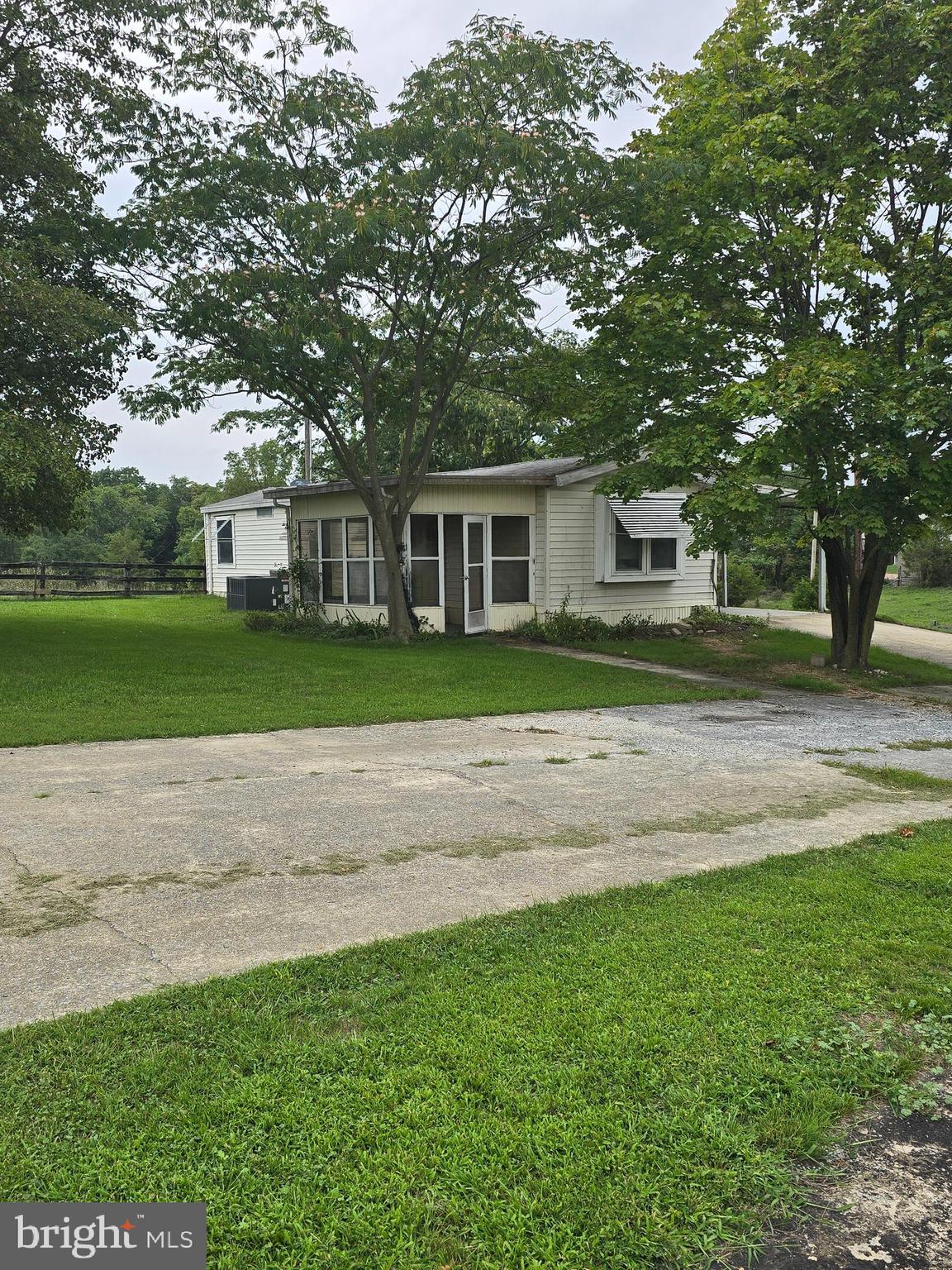 14+/- acres with development potential. Property currently has a 1987 mobile home that conveys 2 bedrooms 1.5 baths. Highest and best use of this property suggests townhome or villa lots to meet the high demand of housing in the eastern panhandle. Public water and sewer beside property in Mills Farm.
Final plat being recorded to show exact amount of acreage.