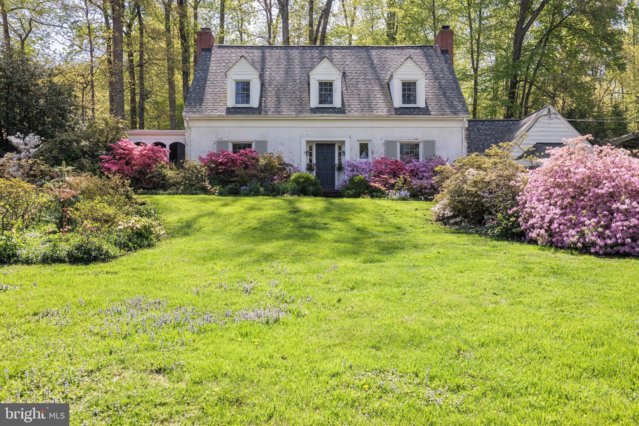 Charming Cape Cod on a gorgeous, .63-acre lot in Bradley Hills Grove.