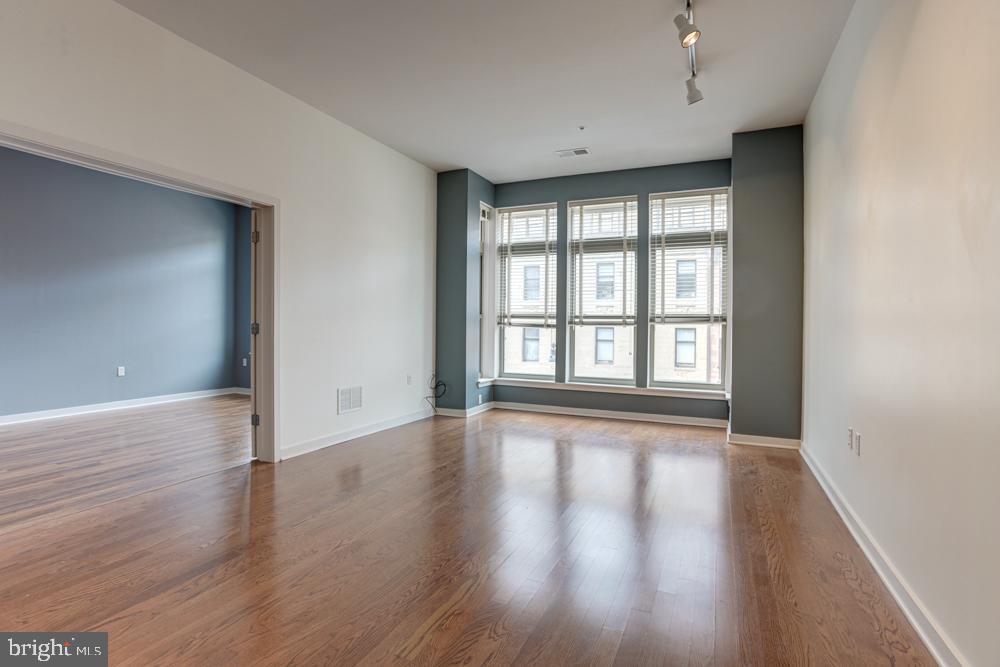 Welcome to sensational city living at 1209 North Charles Street #209, nestled in the heart of Mount Vernon Neighborhood, Downtown Baltimore! This chic 973 sq ft, 1-bed, 1-bath condo offers an open-plan living space brimming with natural light and fantastic high ceilings that bring a sense of airiness and scale.
The superb living space boasts upgraded hardwood flooring throughout, injecting a touch of elegance to this upscale dwelling. The gourmet kitchen, graced with stainless appliances and luxurious granite counters, invites you to explore your culinary prowess.
Amidst the hustle and bustle, enjoy the convenience of an in-unit washer/dryer along with the security of a deeded parking space 17A—all included! The building further extends comfort and lifestyle amenities including a charming courtyard, state-of-the-art gym, protected garage, and an Amazon Package Digital Locker for secure deliveries.
Hungry or looking for entertainment? A plethora of vibrant restaurants and bars are just a stone's throw away. Perfect for city-dwellers, access to I83 and Penn Station is straightforward—making commuting a breeze.
Experience this wonderful condo and discover your perfect urban retreat. Don't wait! Contact today to schedule a showing and witness this fantastic offering first-hand.
