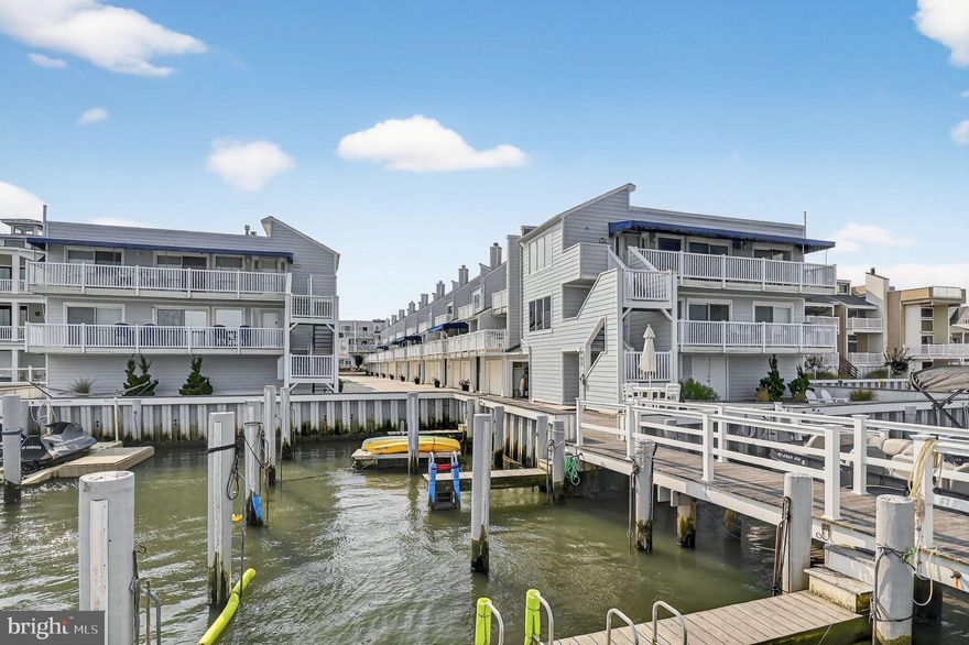 Welcome to Marina Mews. This stunning bayfront townhouse includes a boat slip, pool, and endless views! Enjoy breathtaking open bay views
from this mint-condition townhome that has been fully renovated from top to bottom. This 3/4-bedroom retreat features a spacious master suite
with private deck overlooking the bay, plus a bonus room/den that can serve as a 4th bedroom. Highlights include: Gourmet kitchen with quartz
countertops, high-end stainless steel appliances, custom backsplash, and under cabinet lighting. Bright great room with hardwood floors, gas
fireplace, and access to multiple decks with panoramic bay views. Updated baths with tile showers and granite vanities. 3-car garage with
epoxy flooring, bar/entertainment area, and additional storage. Community pool for relaxing by the water when you’re not out on the boat.
Multiple outdoor spaces: two front decks, rear deck, and enclosed outdoor shower. Recent upgrades include newer gas heat & central air, high
-efficiency tankless water heater, new 200-amp electric service, new carpeting, and fresh paint throughout. The home comes beautifully
furnished and decorated, truly move-in ready. Whether you’re lounging by the pool, watching the sunset from the pier, or heading out on the
water from your personal boat slip, this property delivers the ultimate bayfront lifestyle.