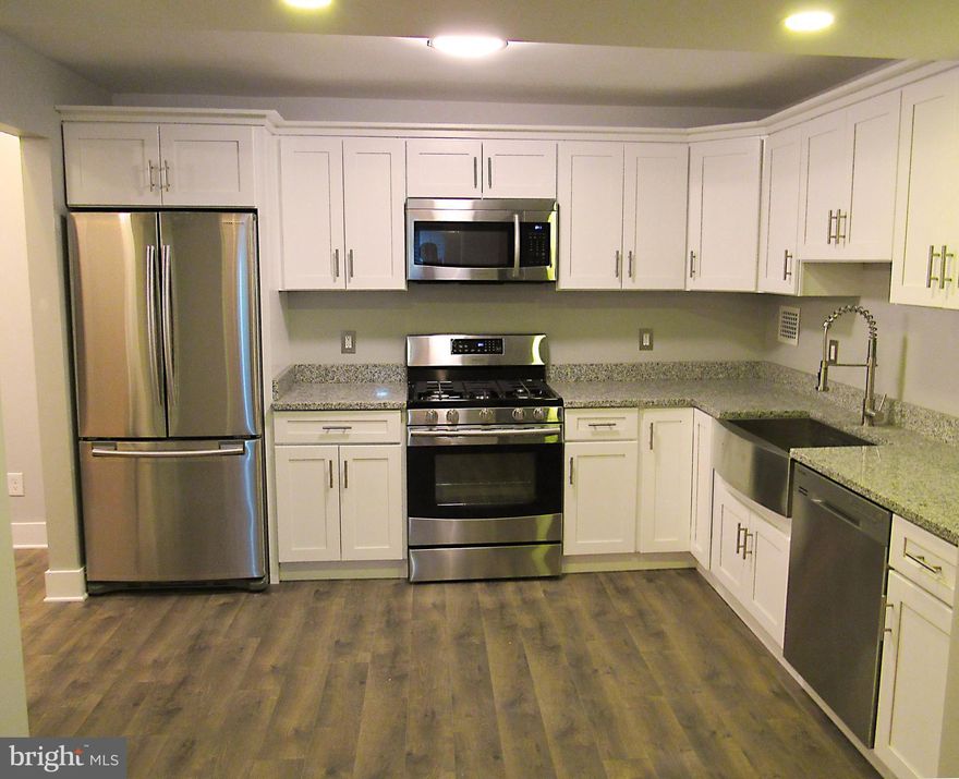 Amazing urban contemporary remodel - craftsman style! Soft close shaker cabs, granite counters, Samsung appl's, Huge apron sink, Pergo floors.  Spa-like bathroom- Grey glass tile, stone accents, frameless shower doors, rainfall head; double sink, wood-look ceramic floor, waterfall faucets. GARAGE, Pool, Fitness, Concierge