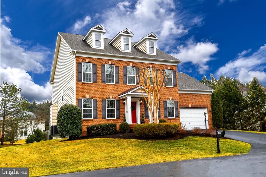 Absolutely Stunning Brick-Front Colonial | Over 5,000 Finished Sq Ft | Fair Lakes Welcome to this exceptional 4/5-bedroom, 4.5-bath brick-front colonial offering more than 5,000 square feet of beautifully finished living space on a private 1/3-acre lot. Built brand new in 2011 and thoughtfully upgraded throughout, this home combines timeless elegance with modern comfort in one of Fair Lakes’ most desirable settings. From the moment you enter, you’re greeted by sun-drenched interiors, soaring ceilings, and gleaming hardwood floors that flow seamlessly across the main level. Expansive windows fill the open floor plan with natural light, creating an inviting and airy atmosphere. The heart of the home is a spectacular chef’s kitchen featuring granite countertops, high-end stainless-steel appliances, rich cherry cabinetry, butler's pantry, additional large walk-in pantry with custom built-in wood shelving, and generous prep and gathering space — perfect for everyday living and effortless entertaining. Host elegant dinners in the formal dining room or work comfortably from the spacious main-level office. Upstairs, retreat to the luxurious owner’s suite, a private sanctuary boasting a spa-inspired bath and multiple walk-in closets with built ins. Three additional oversized bedrooms, 2 with Jack and Jill bathroom, and the 3rd with en-suite bathroom, provide ideal accommodations for family and guests. The convenience of an upper-level full-size LG smart washer and dryer makes daily living even easier. The fully finished walk-out lower level is an entertainer’s dream. With windows, recessed lighting, a custom wet bar with high-end cabinetry and granite counters, a massive recreation/game room, private guest suite with full bath (not a legal bedroom), and ample storage rooms — this space offers incredible flexibility for gatherings, hobbies, or multi-generational living! Step outside to your level backyard and paver patio, professionally landscaped yard with comforting water feature — ideal for relaxing evenings, play, or hosting summer barbecues. Recent upgrades include: Brand-new 2-zone smartphone-controlled HVAC system (Nov 2025) New stainless steel appliances (2022) New LG washer & dryer (2022) New Hot Water Heater (2024) Full irrigation system, brand new carpet BR level and FR 2026. Located in the highly sought-after Fairfax County school pyramid (Poplar Tree ES, Rocky Run MS, Chantilly HS) and surrounded by scenic parks and trails within walking distance, commuter options also within walking distance, and premier shopping and dining — this home truly offers the best of convenience and community. This is more than a home — it’s a lifestyle. Don’t miss this rare opportunity to own one of Fair Lakes’ finest residences.