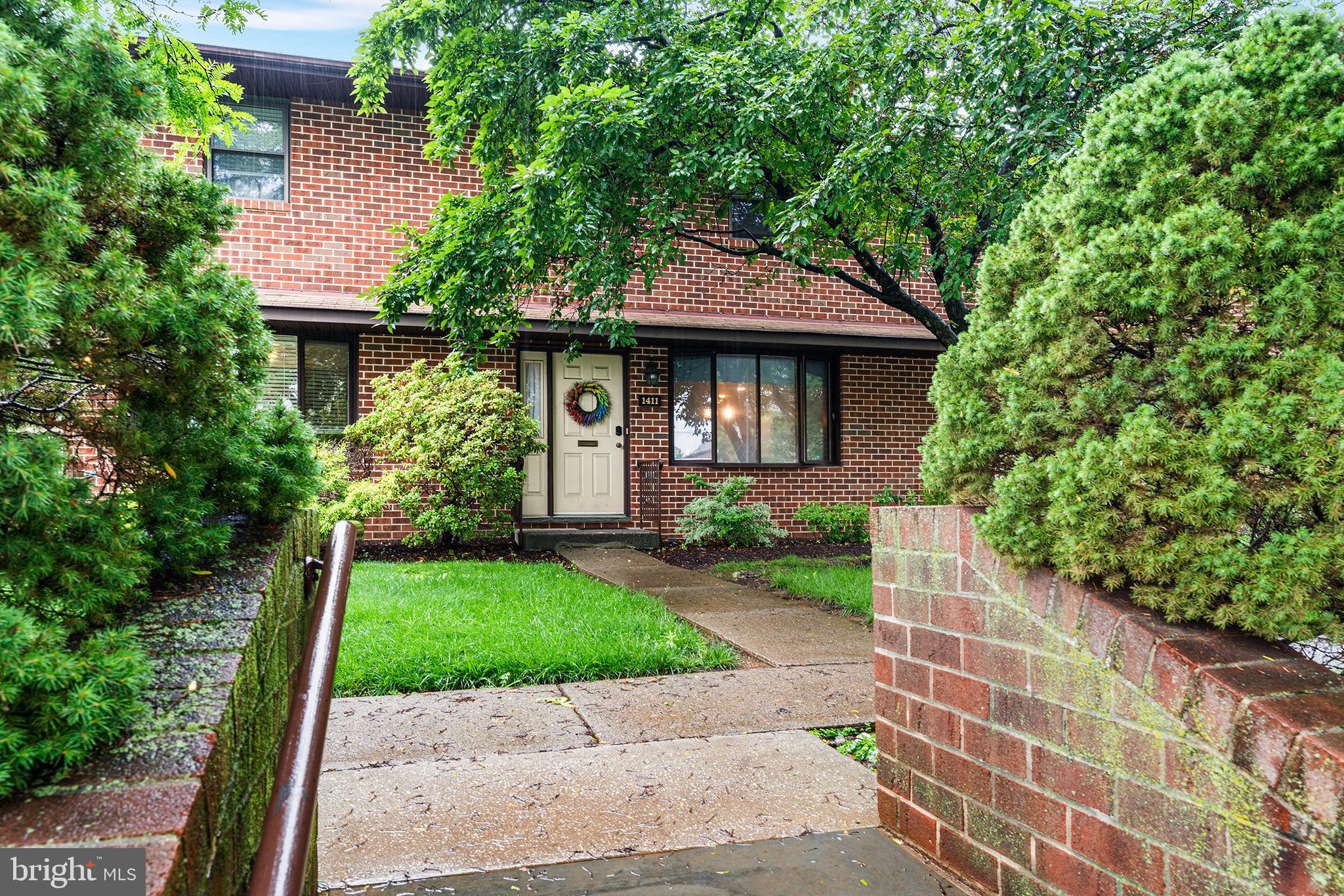 This beautifully maintained brick colonial features maintenance-free living. A welcoming foyer entry with a large coat closet leads you to a spacious open concept living/dining area with sliding doors that lead you to a private balcony featuring a retractable awning. The galley-style kitchen, loaded with cabinets and counterspace, features a large bay window and provides a convenient breakfast nook. The washer/dryer and wash tub are conveniently located within a large 9-foot closet space. New flooring on the entire 1st floor. The second floor offers a generous primary suite with two large double closets, and an en-suite with a dressing area, built-in storage, and a separate room for tub/shower and toilet. Two additional oversized bedrooms with double lite closets, and a full bathroom with separate rooms for vanity and toilet, and a shower complete this floor. The walk-out lower level is fully finished and features a 2nd half bath, two double closets, and entry to an oversized 2-car garage. Outside, you will find a large driveway with alley access for ample off-street parking. All within minutes to Historic Bethlehem, where you can enjoy the many shops and eateries, or visit the annual highly anticipated events such as Musikfest in the summer and Christkindlmarket in the winter.