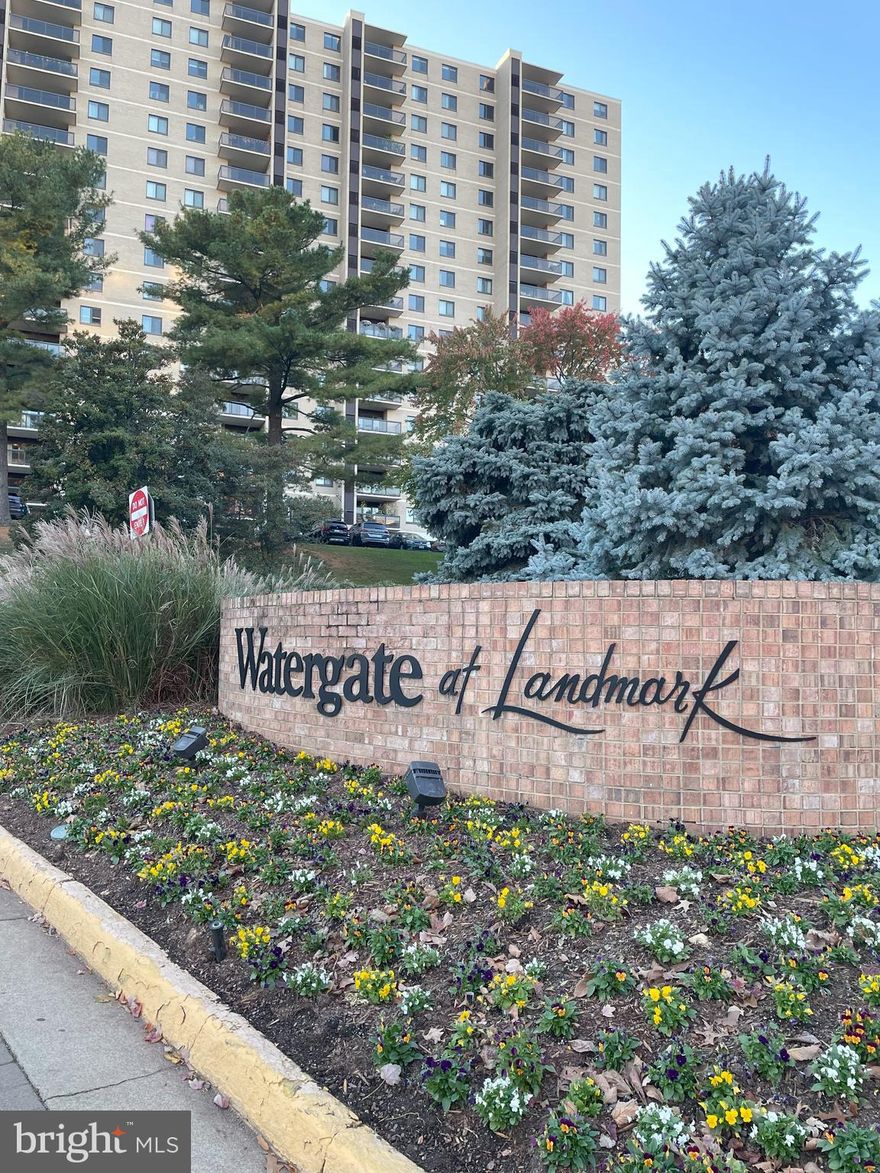 PENTHOUSE Your Oasis in the City! Welcome to this rare 2-bedroom 2-bath Penthouse located in the "Watergate at Landmark" luxury gated community in West End Alexandria. The 1,309 sf open floor plan boasts an unparalleled view overlooking both Stevenson Park and West Springfield. Watch the sunset on the horizon every day from its private balcony. (Quick access to the building’s rooftop terrace also gives a stunning 360-degree view of Alexandria!) Watergate at Landmark is a luxury gated community that sits on 35+ Acres with extensive landscaping, paths, mature trees, and gardens. Premium Assigned Garage Parking Space conveys along with an additional unreserved space in the open parking lot. Monthly parking fees are separate. Monthly payment includes electricity, water, sewer, trash, recycling, and Master Insurance Policy. Each home owns and controls its individual residential heating and air conditioning system. The 2-bedroom and 2-bath penthouse boasts a generous 1,309 sf open-floor plan plus an extra three large closets (and one linen closet) as well as extra storage within the building. Remodeled Kitchen with White Cabinetry and Stainless Steel Appliances, Quartz Countertops, and Ceramic Tile Flooring. Living/Dining Rooms and bedrooms have luxury engineered wood flooring. All of the Watergate’s Resort-style Amenities are included in the monthly condo fee. It’s luxury amenities include a sprawling Outdoor Pool with a waterfall, separate lap-lanes, and diving areas. Enjoy multiple social areas with Gazebos, mile-long Jog/Path, Outdoor lighted Tennis Courts, Indoor Tennis Courts, Basketball Court, Pickle ball, Outdoor Volleyball area, Racquetball Clubhouse, Picnic Areas with Grills, Tot Lot, Indoor and Outdoor gathering areas, Fitness Center, Jacuzzi, Saunas, Indoor Pool with separate lap-lanes, Billiards, Ping Pong, Indoor Golf-driving, Outdoor Put-Put Green, Library, Community Center, Party rooms, Car Washing Area. Residents can also Conveniently Access the community center, fitness center, indoor pool, new convenience store and restaurant, dry cleaners, hair salon, etc. via the underground passageway. Residents can also take part in Fitness Classes and Organized Social Events for all ages. The complex is actively secured day and night with two gated entrances and mobile guards. Guests are welcome to visit with owner permission. An active HOA and residential management company ensure active maintenance as well as handyman services. A newsletter of events and notices is published weekly. Watergate at Landmark is minutes from the future Inova Hospital campus and the Landmark Mall redevelopment project. Residents have easy access to parks like Ben Brenman and Holmes Run, local farmers markets, and multiple major grocery stores. Nearby Duke Street and Van Dorn offer a diverse mix of international markets, casual restaurants, and everyday conveniences. Ideally located just minutes from Washington, D.C., the Pentagon, Amazon HQ2, Reagan National Airport, Old Town Alexandria, and Fort Belvoir, this home combines luxury, convenience, and comfort in one of Northern Virginia’s most desirable gated communities.