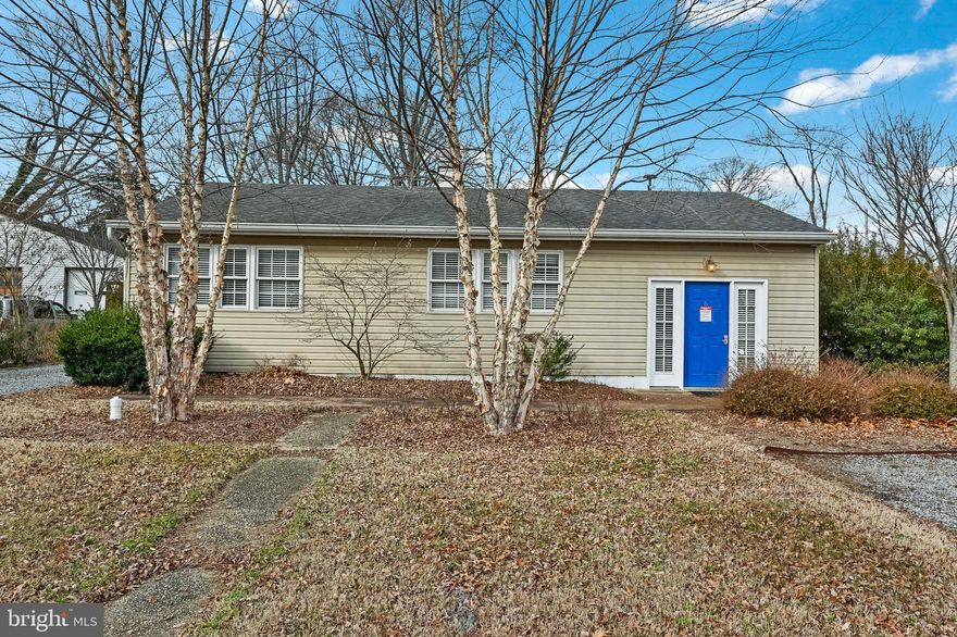 C-2 zoned property with 1,088sq' main office offering a spacious conference room, one private office, a manager's office, and large shared working space for multiple desks, etc. Full kitchen, and updated half bathroom. Welcoming front office entrance with glass french doors to either the conference room or the working office area. Natural sunlight throughout gives the entire space a warm and inviting energy! A separate 1200sq' workshop with storage located behind the main office is the hidden gem of this property: a 30' x 40' structure divided into multiple uses. 12' x 12' roll-up door with drive-in access and 14' ceilings, workshop bathroom, expansive upper-level storage, and lower-level workroom with separate side entry door. The graveled parking lot can accommodate approximately 10 cars/trucks/trailers, plus additional parking at the front of the main office (driveway), and street parking is allowed.