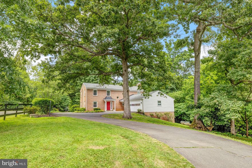 Welcome to your dream retreat in the heart of Great Falls! Nestled on 7.27 acres of picturesque landscape, this turnkey colonial home offers an idyllic blend of charm and nature. Featuring 5 spacious bedrooms, 3 full bathrooms, and a half bath, this residence is perfect for comfortable family living and entertainment. The main level greets you with a sun-drenched living room, a formal dining room, and a cozy family room complete with a charming fireplace. The beautifully renovated kitchen is the heart of the home, boasting quartz countertops, a high-end range with four gas burners and a built-in griddle, a large farmhouse sink, and a subway tile backsplash. An oversized island provides ample space for meal prep and casual dining. Adjacent to the kitchen is a serene sunroom, ideal for relaxation or extending your entertainment area, which leads out to a beautifully fenced yard.  The upper-level features gleaming hardwood floors throughout, four generous bedrooms, and two full bathrooms. The primary bedroom is a true sanctuary, offering a private balcony with stunning scenic views, two walk-in closets, and an ensuite bathroom with a dual-sink vanity and renovated shower. The walkout basement, fully tiled for easy maintenance, offers versatile living options. It can be used as a studio apartment or in-law suite, complete with a full bath and a small kitchenette. There's also an additional room that can be transformed into a study or home office. The basement opens to a brick patio that flows seamlessly into the expansive, fenced yard. This property is a haven for equestrian enthusiasts, featuring a barn with 5 stalls, and a tack room, allowing you to keep horses and fully enjoy the equestrian lifestyle. The HOA Pond offers a peaceful spot for fishing, and the neighborhood is designed with equestrian trails, providing a serene and quiet environment. Located just minutes from commuter routes, Tysons Corner, and Reston Town Center, this home offers convenience and accessibility to top-tier dining, shopping, and entertainment options. It’s also close to the Metro Silver Line, Dulles International and Reagan Airports, Great Falls Park for hiking, and the vibrant city life of Washington D.C. This property is within the prestigious Langley High School pyramid. Don't miss this exceptional opportunity to embrace living in a tranquil, equestrian setting. Reach out today for more information and make this stunning property your next home!