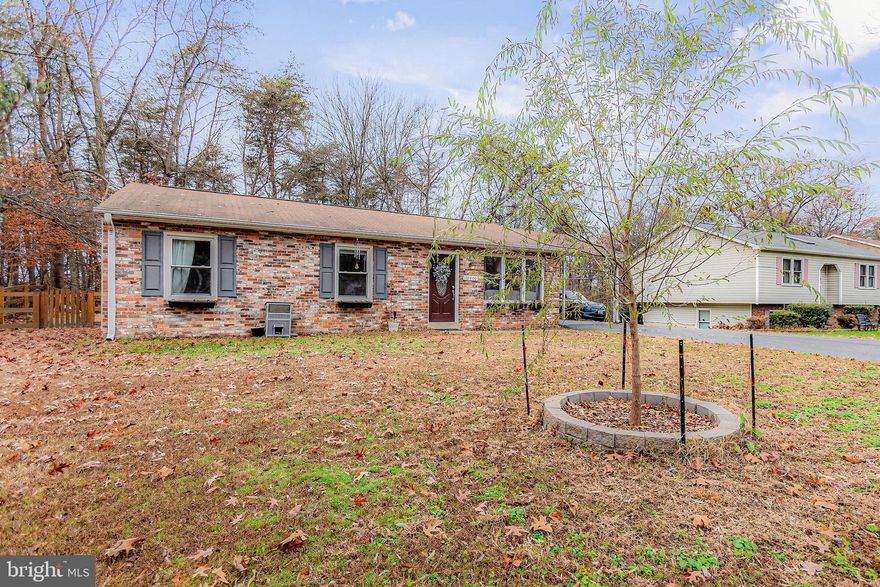 Welcome to this inviting one-level home in Fredericksburg, set on a spacious half-acre lot and featuring a new roof. With its classic brick front, covered carport, and long driveway, this home offers both curb appeal and everyday convenience.

Inside, you’ll find newer LVP flooring and recently refreshed interior paint, creating a bright, comfortable atmosphere throughout. The living room features a wood-burning fireplace insert and large windows that bring in plenty of natural light, making it an easy place to relax or gather.

The kitchen offers updated finishes, flowing naturally into the dining and living areas for easy day-to-day living. Bedrooms are well-sized with flexibility for a home office, guest room, or additional living space. The bathroom includes a deep soaking tub, perfect for unwinding at the end of the day.

Recent improvements include added insulation to help improve energy efficiency. Outside, the fully fenced backyard provides room to spread out, entertain, or enjoy the outdoors, and the playground conveys. A shed offers convenient storage.

Located near Mine Road with quick access to downtown Fredericksburg, Cosner Corner, I-95, and Route 1, this home offers the perfect balance of space, comfort, and location. Come see it in person and imagine making it your own.