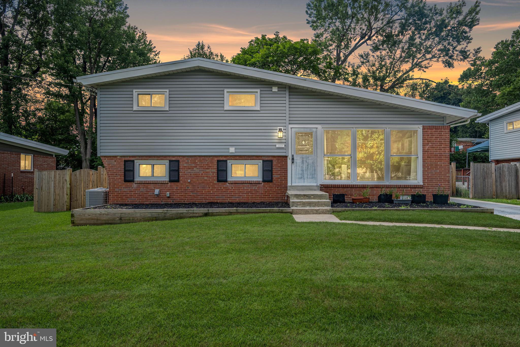 Welcome to comfort and style in this thoughtfully renovated 3-bedroom, 2-bath single family home nestled in the heart of Twinbrook! Bathed in natural light, the main floor welcomes you with tall ceilings, oversized windows (2020), gleaming hardwood floors, and recessed lighting (2021). The open layout flows seamlessly into the beautifully designed and renovated kitchen (2021). As the heart of the home, the kitchen features quartz countertops, a custom tile backsplash, built-in niche, under-cabinet lighting, a large center island with extra storage and backlit display cabinets, and stainless steel appliances—including a French-door fridge and gas stove. The perfect space for everyday meals or entertaining loved ones! Upstairs, you’ll find three spacious bedrooms with upgraded modular closet systems (2021) and a stylish, light-filled full bath with modern tilework, a sleek vanity, extra storage with two closets and a Bluetooth-enabled fan/light/speaker combo—offering a spa-like experience. The large lower-level den with built-in cabinetry offers flexible space for a playroom, rec room, or home office. The space also includes a second full bath expanded in 2017, with classic subway tile and a deep soaking tub, as well as a laundry room with large storage area and walk out access. Step outside to enjoy a peaceful summer evening or host your BBQ on the newer patio (2022) with charming string lights, while kids or pets play in the fully fenced in rear yard (2023). The extended driveway (2022) offers off-street parking for two cars and an extra storage shed. Other major updates include a newer roof (2020), gutters, siding, windows, and patio door (2020), HVAC and water heater (2023), washer and dryer (2023), and an upgraded electrical panel. Smart touches throughout include dimmable switches (some with USB ports), and upgraded outlets. No HOA! Ideally located just minutes from Rock Creek Trail, Twinbrook Library, shopping, dining, and Twinbrook Metro station (Red Line). Lovingly maintained and full of thoughtful upgrades, this home is a rare find—don’t miss this gem!