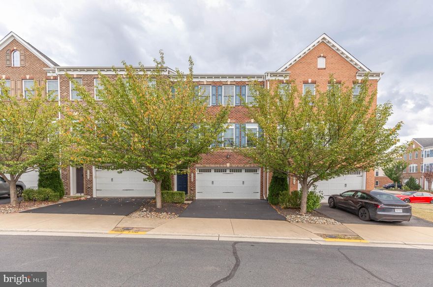 Fresh, bright, and spacious three-level townhome available for occupancy October 1st. This modern and luxurious home offers over 3,200 square feet of living space with elegant finishes throughout. The fully finished basement includes a welcoming rec area, full bathroom, custom bar, and direct access to the fenced-in back patio. The main level features an open-concept design with a gourmet kitchen boasting granite countertops, recessed lighting, custom built-in cabinets, along with a dedicated dining area, large walk-in pantry, and powder room. Step outside onto the expansive Trex deck, perfect for relaxing or entertaining. Upstairs, the primary suite offers two walk-in closets and an updated en-suite bath, complemented by two additional spacious bedrooms, a third full bathroom, and a convenient laundry area. 2 Car garage and additional 2-car driveway.