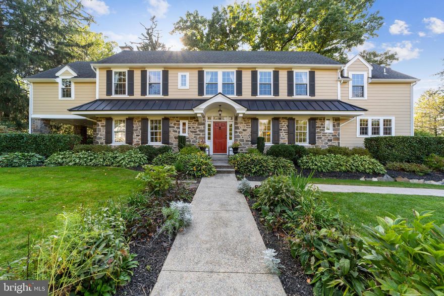 Welcome to 320 South Wayne Ave, this is the “walk to Wayne” stone colonial home you have been waiting for. Renovated and updated, this gorgeous home combines the traditional character and charm of being built in 1929 with today’s modern features and amenities.  This home is truly turn-key, move in ready.  The current owners extensively renovated and updated everything from roof, walls, floors, systems, electrical, plumbing, windows, to the kitchen and bathrooms.  As you step up the front steps to the front walk way, you are flanked with gorgeous seasonal flowers and plantings, as well as mature landscaping around the entire house. Enter the red front door to a warm, open foyer with hardwood floors and open staircase. Powder room with tiled floor and pedestal sink and coat closet are off the foyer.  The hardwood floors continue in the formal living room. This front to back room boosts windows with deep sills, 8” double crown molding, a beautiful mantle around a large brick gas fireplace and French doors out to the backyard. The traditional layout continues with a large formal dining room with crown molding, deep windowsills and hardwood floors.  Custom cabinetry with glass cabinets, granite countertops and base cabinets lead into the kitchen.  The gourmet kitchen is extremely functional and attractive. Custom white cabinets, granite counter tops, large island with seating, deep sink, Thermador appliances and back stairs complete the kitchen.  The Thermador appliances include 6 burner oven, hot water spigot, large custom panel refrigerator, and paneled dishwasher. French doors lead off the kitchen to the family room. The room runs along the back portion of the house and has windows overlooking the gorgeous backyard.  The focal point of the family room is custom built in cabinetry and mantle  surrounding the gas fireplace. The gorgeous cabinetry above the fireplace store the flat screen tv.  Custom cabinets with cubbies flank the side door, for plenty of storage.  The room continues with an area for a table for eating, games or homework. The wet bar has custom cabinetry, a sink and beverage frig, providing more storage and options for entertaining.  Doors leading out to the backyard and carport open up to the patio and side porch. The second floor offers 5 bedrooms, 3 full bathrooms, and an office. The large master bedroom has hardwood floors, crown molding, a large walk in closet, en-suite bathroom and separate office. The en-suite bathroom has handsome custom cabinetry, large stall shower with beautiful tilework.  Off the master bedroom is a large office with a gas fireplace.  Great space to work! Hardwood floors continue through the hallway, with a cozy nook for a desk, cedar closet, large linen closet and 4 additional bedrooms.  All nice size bedrooms with good closets. The hall bath is gorgeous white tile and vanity.  The 5th bedroom is ensuite with a renovated bathroom and large closet, near the backstairs.  The basement has a finished laundry room and has dedicated storage area.  No detail has been left unturned in this home. And it continues as you head out to the backyard. The lush, mature landscaping give this lot a private and expansive feel.  The patio off the back has great space for entertaining and leads to the covered porch off the side of the house. Truly characteristic of this quintessential home is the side porch with tall stone pillars and ceiling fan.  There is also a large carport that has a gas line for the gas grill, recessed lighting and electrical. A large shed offers more storage.  The south wayne neighborhood  offers neighborhood events, such as Porchfest,  bookclub, and progressive dinners.  Award winning Radnor School District.  This stunning home offers it all in the coveted walk to Wayne location!! Final and best offers due Monday, Oct. 11th by2pm.