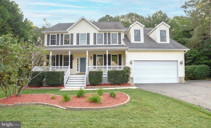 Lots to love in St. Leonard! This Woodhaven Colonial offers 5 upstairs bedrooms, lots of upgrades, a great commuter location, composite decking and a detached 30x24 garage/workshop! Hardwood and DuraCeramic tile flooring are featured and freshly painted and new carpet throughout the house. Welcoming two-story foyer, dedicated home office/playroom, formal living and dinings rooms and spacious family room surround the eat-in kitchen w/ stainless appliances, Maple cabinets, island, pantry and built-in desk. Get cozy in front of the propane fireplace or enjoy a nice day on the low-maintenance deck that backs to trees. Primary suite with big walk-in closet and bath featuring soaking tub, separate shower and double vanities. Four more bedrooms upstairs provide plenty of space for all. Lower level features a partial-finish bonus room with laminate wood flooring and drywall already installed. With the egress window, add a closet and it could be a sixth legal bedroom. Lower level also has tons of potential with full bath rough-in and unfinished space w/French door walk-out to paver patio and backyard w/white picket fence. Two-car attached garage enters into convenient mudroom. Detached garage/workshop w/ 220/v electric is a car enthusiast or wood worker's delight! No HOA, new roof and gutters in 2013, new windows and water heater in 2017 and 2021 1st-floor HVAC and leaf filter systems are finishing touches that make this a "don't-miss" home. Seller is offering a 1 year Home Warranty! Schedule your showing today!