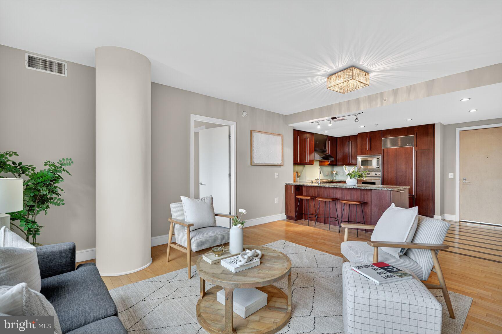 Bright and sunny 2 bedroom, 2 bathroom condominium with stunning Potomac River views and high-end, upgraded finishes at The Odyssey in Court House.    Your future home includes a primary suite with two large walk in custom closets, and large bathroom with double vanity, jacuzzi tub and separate glassed in shower.  Second bedroom also has a walk in closet and its own adjacent bathroom.  Hardwood floors in living areas, soft carpet in bedrooms and Southern exposure.  Kitchen includes Wolf cook top and Subzero refrigerator.  Full service building amenities include: 24-hr front desk, building engineer and maintenance, roof top pool and terrace with grills and panoramic monument views, elegant party lounge club room with pool table, business center/conference room, sauna, large penthouse gym and storage units for rent.  Washer/dryer in unit, and assigned garage parking!  2 short blocks to Court House Metro station and walk to many restaurants, shops and gyms.  And only a 10 minute walk to either Rosslyn or Clarendon, and its Trader Joes and Whole Foods, along with Ballston, and easy access to highways to DC, Tysons and beyond.