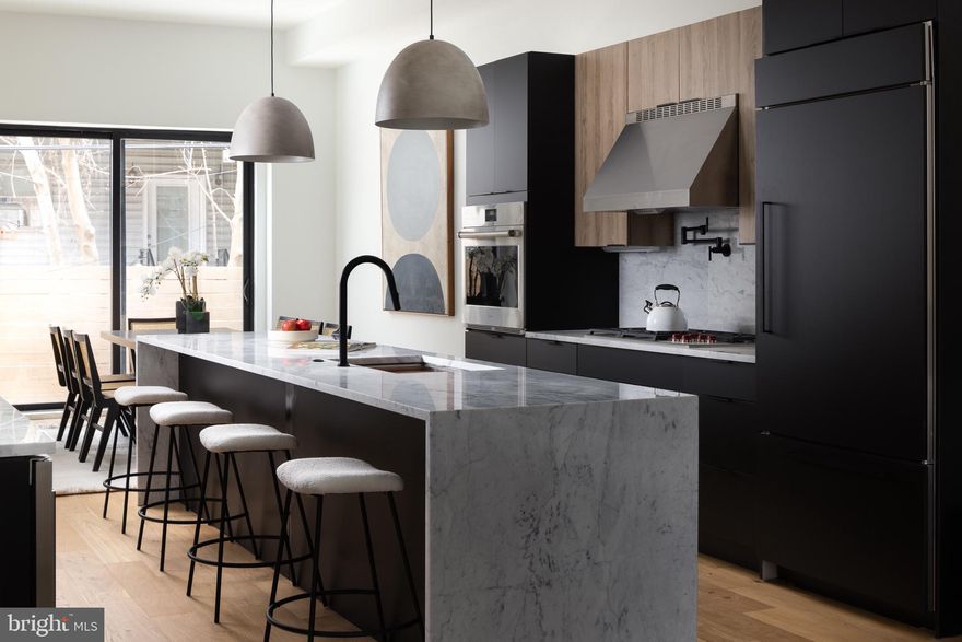 An architectural and striking new construction home for sale in Fairmount, this brand new residence is teeming with contemporary design and modern touches. Featuring a stunning roof deck, two car parking, and spacious sun-soaked living spaces. The open floor plan is over 3,500 square feet and features four (4) bedrooms and four and a half (4.5) bathrooms, with several private outdoor spaces! Light pours down from the skylight onto the island of the chefs kitchen which comes fully equipped with Wolf and Sub Zero panel-ready appliances, marble countertops and two tone kitchen cabinets. Adjacent to the kitchen is a spacious wet bar which offers additional cabinet storage, counter space, wine fridge and prep sink. Leading up to the second floor, this living level offers two oversized bedrooms, each with an on-suite bathroom with imported tile and hardwood vanities. Passing the full walk-in laundry room and hallway closets the floating stairs lead up to the primary living level. An additional dry bar, enormous primary bedroom , walk-in closet and primary bathroom await on the third floor. The primary bathroom is especially inviting with radiant heat s floors, double shower head system and a soaking tub. To bring the vision to a dramatic close, you will be greeted by a panoramic rooftop view of center city Philadelphia. Just steps to all of the attractions of Fairmount Avenue, from local bars and restaurants, to the trails along Boathouse row, all just a short drive from Center City. *This home comes with a full 10 Year Tax Abatement and 1 Year Builder's warranty* 
*Parking is setup for electrical charing station for electric vehicles i.e Tesla*