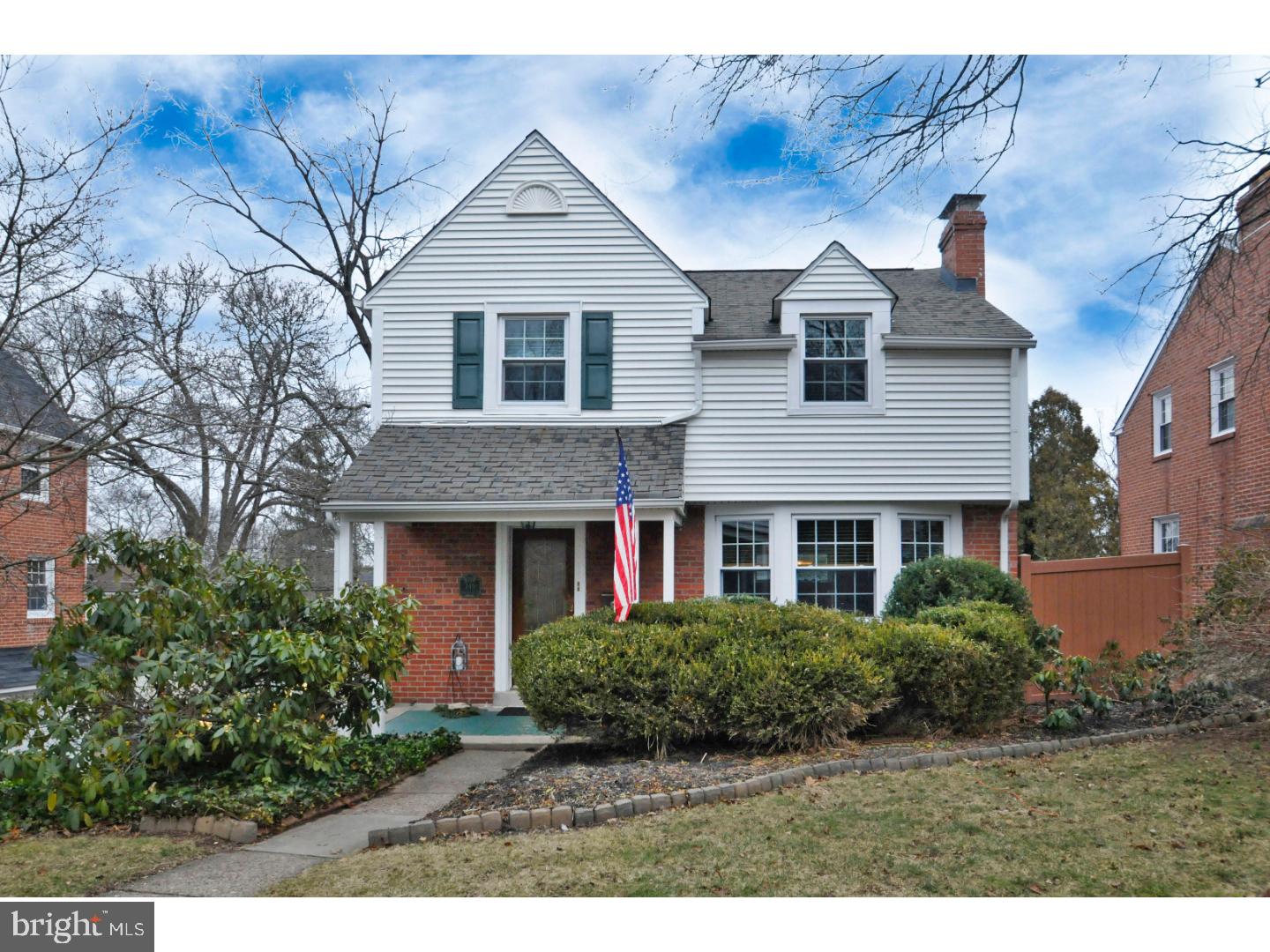 Fantastic 2 story Brick Colonial Home in the sought after Springfield Township, Northwoods Area. Pride of ownership is evident in this meticulously maintained home. Covered patio as you enter the front door to the light filled living room with marbled tiled, colonial wood mantel fireplace for those cold winter nights. Formal Dining Room that leads to an updated kitchen with Cherry Cabinetry, wine bar area, tiled back-splash and plenty of cabinet space. Family room is off the kitchen with an open floor plan feeling and exposed brick wall with plenty of windows to bring the outdoor in to this fantastic addition.  Adjacent to the family room is a full glass colonial door that leads you to a wonderful deck that views the beautifully landscaped large fenced in yard and patio. The second floor consists of 3 nice size bedrooms with hardwood flooring and access to a large half floored attic with plenty of ventilation for storage.  The hall bath was totally updated with natural ceramic tile. Full basement with 2 outside egresses, built in workbench and an extra toilet. Two car GARAGE. Capping around all windows and exterior trim?Maintenance Free! Walking distance to train. Make your appointment today!