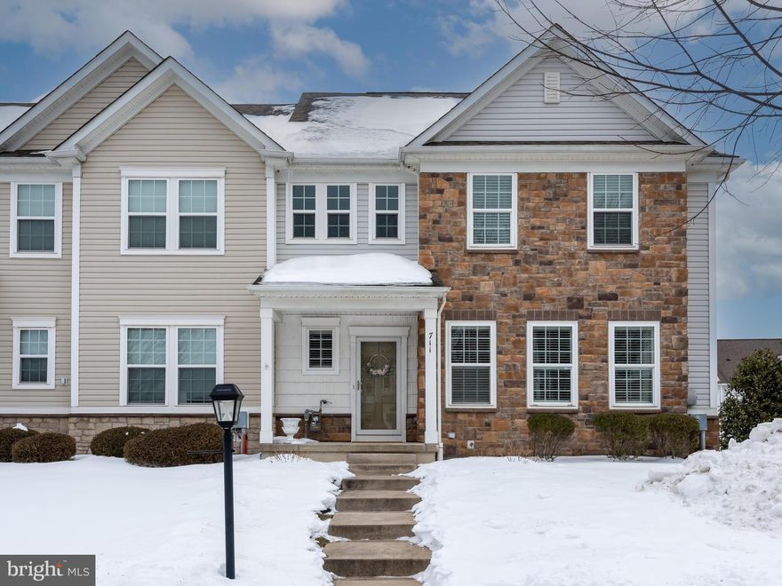 Welcome to 711 Sun Valley Ct — a beautifully maintained end-of-row townhome in the sought-after Courts at Chester Springs community, located within the award-winning Owen J. Roberts School District. Step inside to a bright and airy two-story entryway that immediately sets the tone for this inviting home. The main level boasts a desirable open floor plan, perfect for both everyday living and entertaining. The living room is spacious yet cozy, featuring soaring vaulted ceilings, a fireplace, and multiple windows that flood the space with natural light. Just off the living room, you’ll find the kitchen and dining area seamlessly connected for easy flow. The kitchen showcases beautiful countertops, stainless steel appliances, and stylish pendant lighting over a two-tier island — ideal for casual meals or gathering with guests. The dining area provides direct access to your private back deck, making indoor-outdoor entertaining effortless. A true highlight of this home is the main-level primary suite — a rare and luxurious feature. The spacious bedroom includes a large walk-in closet and a spa-like ensuite bathroom complete with dual sinks, generous vanity space, and refined finishes. A convenient half bathroom and laundry room complete the first floor. Ascend upstairs to find two generously sized bedrooms, each offering easy access to a full hall bathroom. The finished basement expands your living space even further, offering endless possibilities. Whether you envision an entertainment area, playroom, home gym, or a combination of all three, there’s room to make it your own. A bonus room provides additional flexibility for a home office, flex space, or secondary family room. Enjoy low-maintenance community living while being just minutes from local shopping, dining, parks, and major roadways for easy commuting. This exceptional home blends comfort, space, and convenience — don’t miss the opportunity to make it yours!