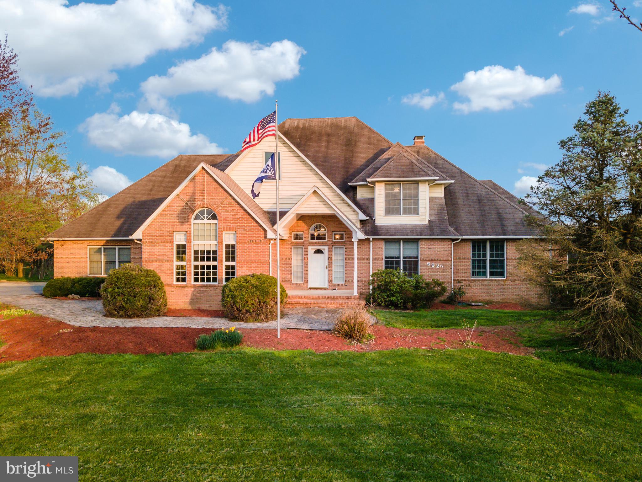 Welcome to your dream come true! Do you love high ceilings?? If so, this home was made for you!! Over 5000+ sq/ft on just the main/upper levels alone. You'll find another 3000+ sq/ft of partially finished basement below. All you need to do is add your carpet and pick the walls paint color. Downstairs electric and even plumbing for a bathroom is already set! Wine drinker? This house even has its own cellar! Upstairs, large windows surround the home, including 12 in the family room which brings a lot of bright natural light into the home. Snuggle up on a cold winter night with the 18 foot high wood burning fireplace. A luxury kitchen which includes lots of granite countertop space and an oversized island. A very open floorplan includes a separate dining room that runs into a beautiful naturally lit sitting/living room. A large 1st floor master bedroom attaches to an oversized walk-in closet and spacious master bath. 3 large bedrooms and brand new carpet upstairs...Like to entertain?? Step outside the home for a second and you'll be greeted by a large deck that overlooks a euphoric view of farmland in the distance and an oversized 30,000 gallon in-ground pool, equipped with a diving board, hot tub and a baja beach shelf in the shallow end with 5 fountains. Over 3 acres of grass land is a landscaper's paradise. Come check out this sublime oasis, tucked away at the high end of a cul-de-sac before its gone!!!