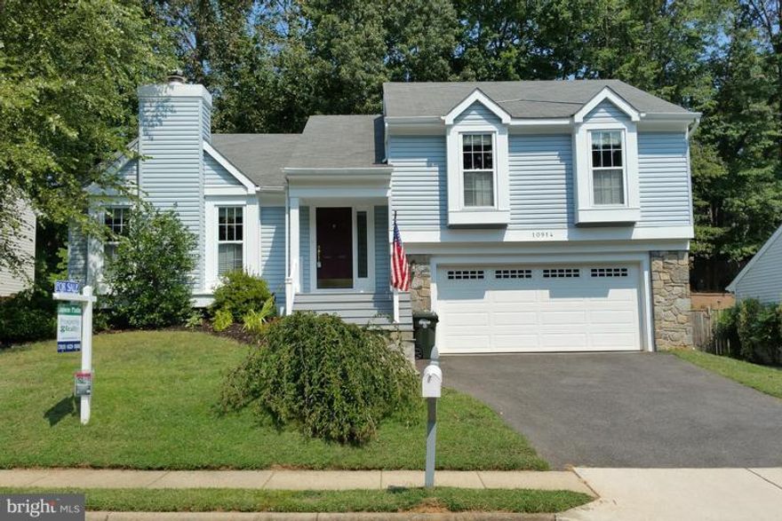 Beautiful home has curb appeal and almost maintenance free backyard.  Updated kitchen, bathrooms and windows.   Generally sized bedrooms.  Large living room with wood-burning fireplace.  Wonderful deck and walk-out basement with recreation room open to upgraded patio.  Two garage parking spaces.