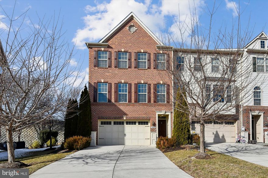 Rarely available brick end-of-group townhome in Hunt Valley Overlook, offering a low-maintenance elevated lifestyle in one of the area’s most convenient and desirable locations. Freshly painted in a soft creamy white palette with tasteful updates throughout, this former model home offers over 2,600 square feet of living space that feels open, elegant, comfortable, and thoughtfully designed for modern living.
The main level is open, and light-filled, anchored by a beautifully appointed kitchen with an oversized granite island, stainless steel appliances, full-height maple cabinetry, and exceptional storage—including two pantry closets. Hardwood floors, crown molding, and solid oak stairs add quiet sophistication without feeling formal.
The primary suite is a true retreat, featuring vaulted ceilings, a bay window, and a large custom California Closets walk-in closet. The en-suite bath is spacious and spa-like with double vanities, a walk-in ceramic-tiled shower, and a soaking tub.
A fully finished lower level adds flexibility and privacy with a full bath and direct access to the two-car garage (with storage) and a private patio—ideal for a family room, guests, work-from-home space, a home gym, or effortless entertaining. The brick exterior, double-stacked bay windows, and recent front shutters enhance curb appeal while filling the home with natural light. The expansive Trex deck offers sunset views towards Hunt Valley—perfect for entertaining or unwinding at the end of the day.
The location is prime. Quiet, yet minutes to Hunt Valley Towne Centre, with premier conveniences including Wegmans, restaurants, fitness, and everyday essentials. Top rated schools and the nearby NCR Trail offers miles of scenic walking and biking, while easy access to I-83 makes commuting a breeze.