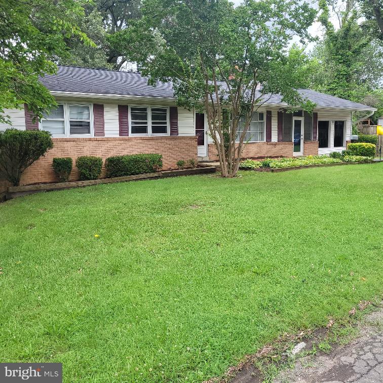 Great Lanham location and fantastic potential for this large rambler/rancher with a basement. Sold strictly AS-IS. Seller will not make or agree to any repairs at all. Good bones but needs a full rehab. Kitchen has already been removed. Main level hall bath has very nice like new bath fitter insert. Beautiful large yard. Appears the former breezeway and garage were enclosed at some time in the past to make even more living space.