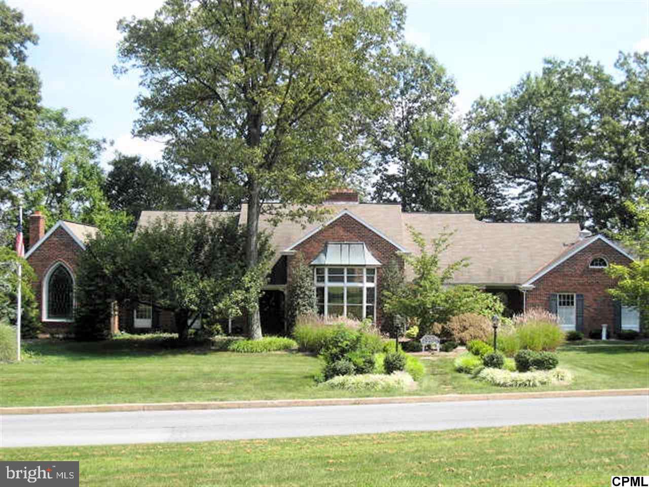 Orig. built in 1987 added to & renovated thru 2009. Exquisite brick beauty w/8 real fireplaces on the main level in lvgrm, library, fam rm, den, mstr bdrm, mstr bath, game rm, & patio. Pegged wood floor, wainscoting, chair rail, custom woodwork , built ins & windows thru out. Chef's dream kitchen w/Vulcan commercial range & comm. range hood - everything at your fingertips. Decks overlooking landscaped grounds w/open views.