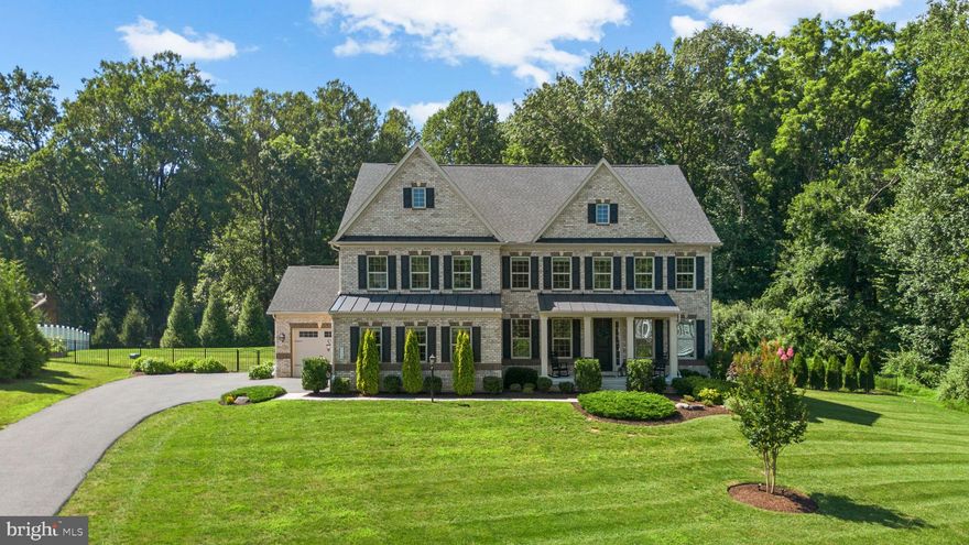 Tucked away at the end of a quiet cul-de-sac in Sykesville’s sought-after Walker Meadows community, this exceptional 5 bedroom, 6.5 bath NVHomes estate blends refined luxury with unmatched natural beauty. Set on 1.34 private acres and backing directly to 16,000 acres of Patapsco Valley State Park, the property offers direct access to miles of scenic mountain biking and equestrian trails. Built in 2020, the home spans over 6,300 square feet of finished space with high-end finishes throughout, including a dramatic two-story great room, chef’s kitchen with quartz countertops and a six-burner gas range, formal dining room with a butler’s pantry, and a main level guest suite. Upstairs, the owner’s retreat features tray ceilings, dual walk-in closets, and a spa-like bath with a soaking tub and a glass shower, while each additional bedroom includes its own private ensuite. The finished lower level expands your living space with a large rec room, yoga studio, full bath, kitchenette, and walk-up access to the backyard. Outside, this home is a true sanctuary with a custom in-ground pool, an outdoor fireplace, a covered deck overlooking the woods, a fully fenced-in backyard, and a patio perfect for relaxing or entertaining.