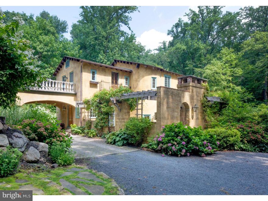 A private driveway hints at the beauty that awaits and transports visitors to the stunning residence known as Jewel Mae.  The  nearly 12-acre setting for this Italian Villa home is a secluded haven, a wonderful weekend getaway or  remarkable full-time residence with a hand rubbed stucco exterior in soothing shades of yellow ochre and soft amber.       The home was carefully designed and constructed in 2002, a work-of-art in its own right. Outfitted with an interesting array of one-of-a-kind features including antique carved doors and 15 foot ceilings, there are plaster walls, barn wood window sills and heated limestone and antique pine floors throughout. Viking appliances and Jerusalem Gold limestone countertops accent the gleaming kitchen and adjacent breakfast area. Steps lead to the sweeping great room where arched and double windows overlook the pool and gardens and provide lovely seasonal Bucks County views. The romantic master bedroom suite has a beamed ceiling, stone fireplace and double doors to a private balcony. A multi-level bluestone patio with outdoor kitchen, gas lanterns, hydrangea laden pergola, open air shower and wood-burning fireplace is a magical outdoor entertaining venue on starry summer nights.        Shopping, dining and recreational activities are found along the Delaware River corridor and easy access to I-78 and the PA turnpike provide a stress free ride to New Jersey, New York and Philadelphia.