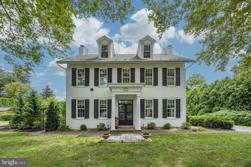 A Palmer Colonial registered historic home like this, is quite a rare find! You will be delighted by the old-world elegance and charm of this property set on 1.29 private acres, with 3,757 sq ft of living and entertaining space indoors, and a beautiful in-ground pool area outside. Enter the home where you'll be greeted with a two story foyer adorned with a stately staircase with decorative stair brackets and  wooden banister, a classy chandelier, and charming millwork including wainscoting & doorways encased in wide 7" decorative trim. To your left is a parlor and to your right is the formal dining room. Straight ahead you'll enter the modern kitchen with all the amenities needed to prepare wonderful meals, such as a cook top stove, double ovens, a farmhouse sink and spacious soapstone counters. Added to its appeal are the exposed brick wall, fireplace and desk area. Just beyond the kitchen and through the dutch doors, is the expansive & brightly lit family room with vaulted ceilings, exposed beams, skylights and a  gas fireplace. Continuing through the home is another sitting area with a fireplace, a half bath, the office and access to a root cellar. From the sitting room, is a private staircase leading to an impressive cigar room. Proceeding to the 2nd floor from the staircase in the foyer,  you'll find a full bathroom and 3 bedrooms. An additional 3 bedrooms and another full bathroom are located on the 3rd floor, in addition to a  large cedar closet. The home has a total of 7 fireplaces (1 gas and 2 wood burning fireplaces are currently in operation; insulation can be removed to allow the remaining fireplaces to be used.) Outside the family room and beyond one of the two patios, is the fenced in pool area with a gazebo for relaxing in the shade.  The peaceful location, well kept grounds with a wood shed, 6' fenced in garden, and a 4 car detached garage make this an oasis worth exploring. It is best appreciated by visiting in person to fully grasp the uniqueness that blends both vintage charm and modern amenities